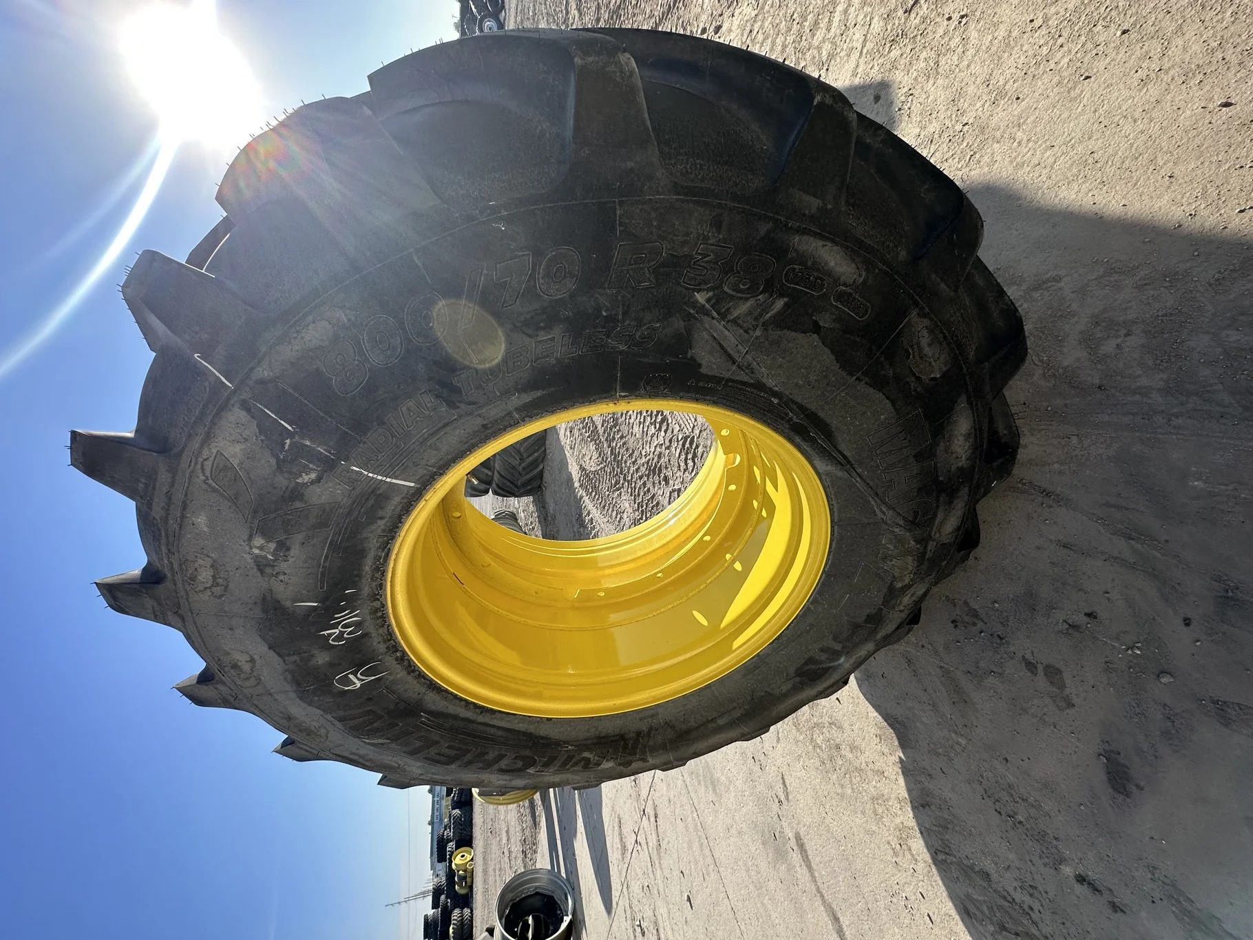 Take Off 800/70R38 Michelin MachXBib R-1W 173D TL on a 27 X 38 JD Yellow 12 Bolt Stub Disc (12