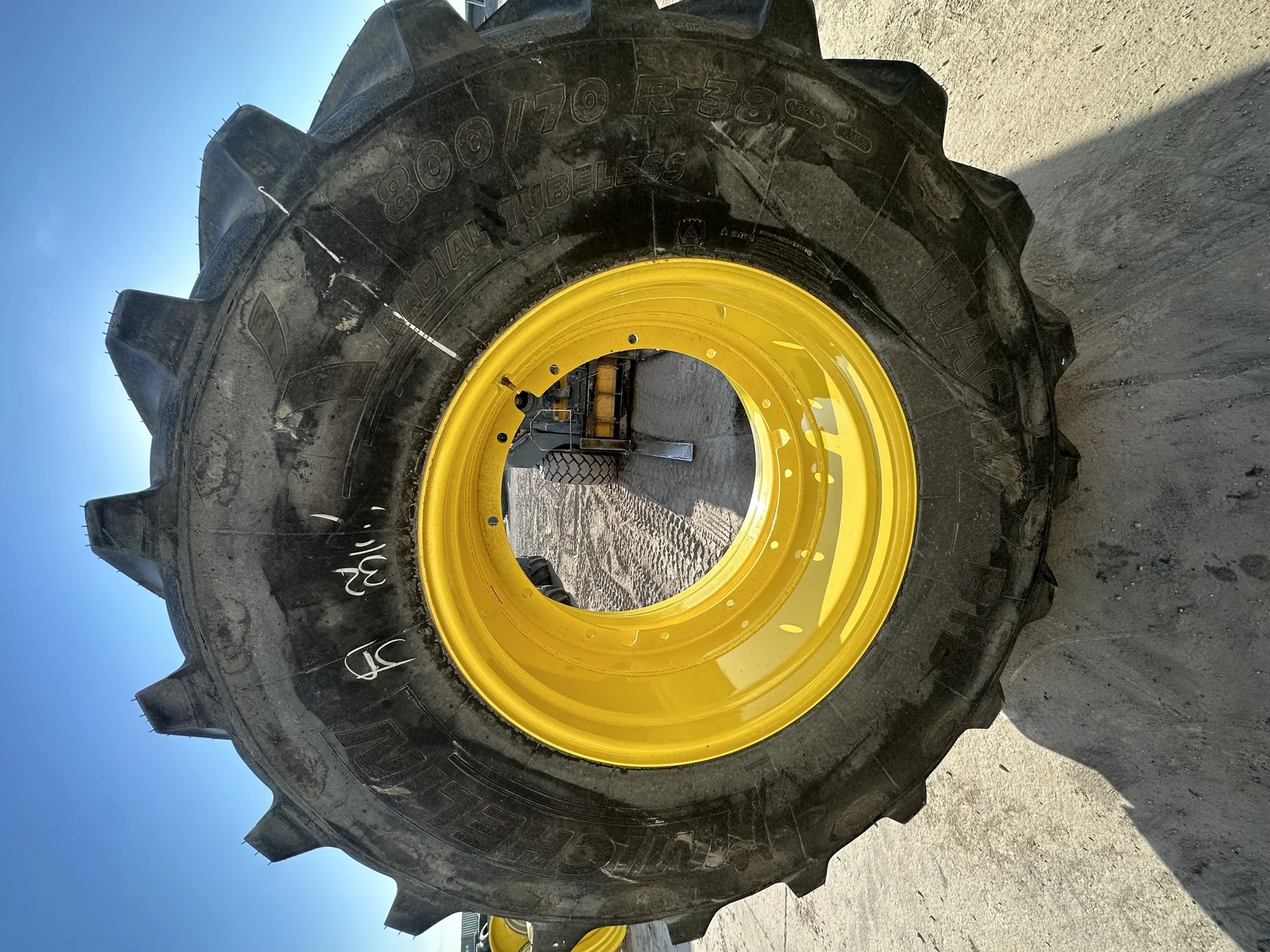 Take Off 800/70R38 Michelin MachXBib R-1W 173D TL on a 27 X 38 JD Yellow 12 Bolt Stub Disc (12 image 2