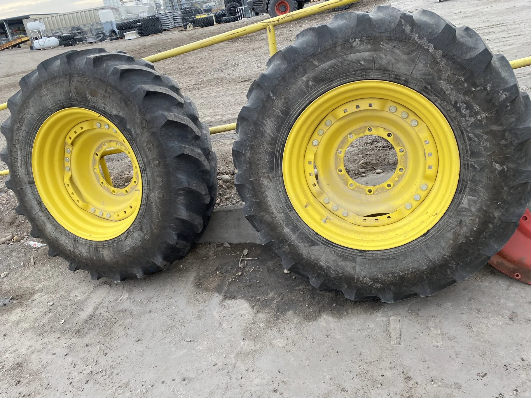 Used 36% 420/90R30 Goodyear Ultra Torque Radial DT 712 (142A8/B) R-1 TL on a 15 x 30 JD Yellow