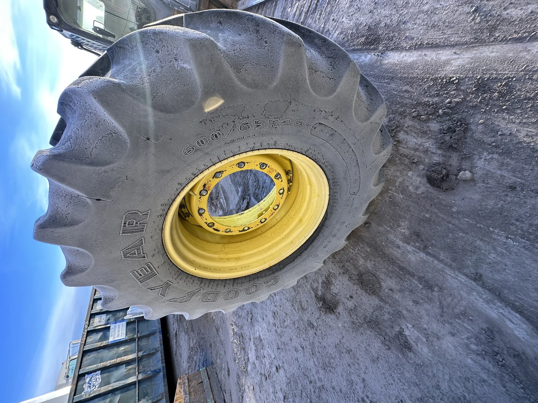 Used 60% 600/65R28 Goodyear Optitrac (147B) R-1W TL on a 18 x 28 JD Yellow 12 Bolt (.906) Waff