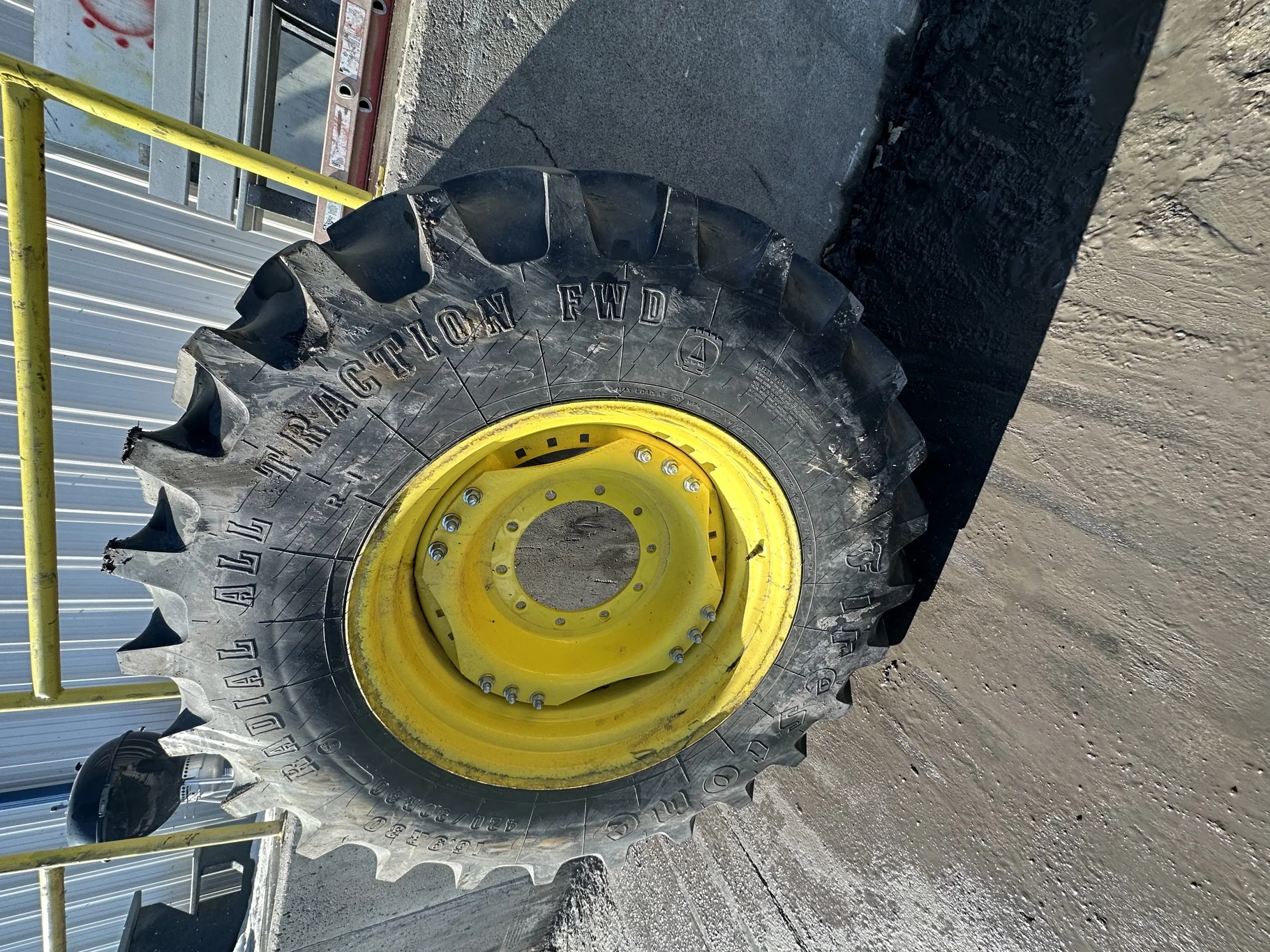 Used 90% 420/90R30 Firestone Radial All Traction FWD R-1 142B TL on a 15 x 30 JD Yellow Waffle