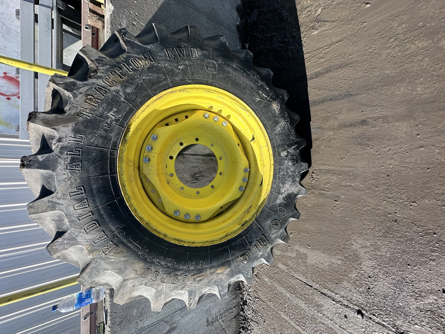 Used 90% 420/90R30 Firestone Radial All Traction FWD R-1 142B TL on a 15 x 30 JD Yellow Waffle image 2