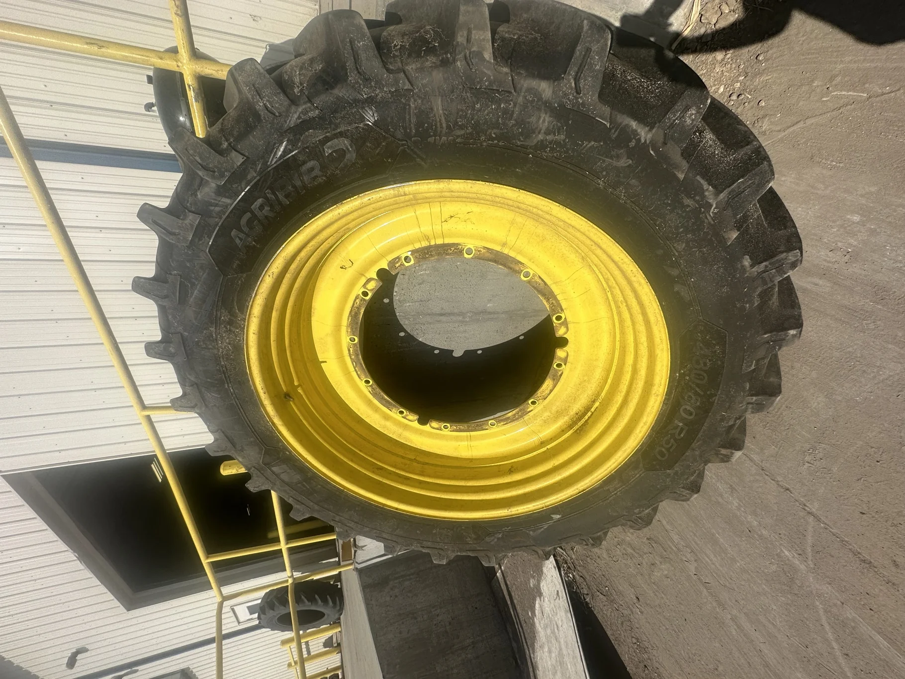 Used 85% 480/80R50 (18.4R50) Michelin AgriBib 2 R-1W (159A8/159B) TL on a 15 x 50 JD Yellow 12