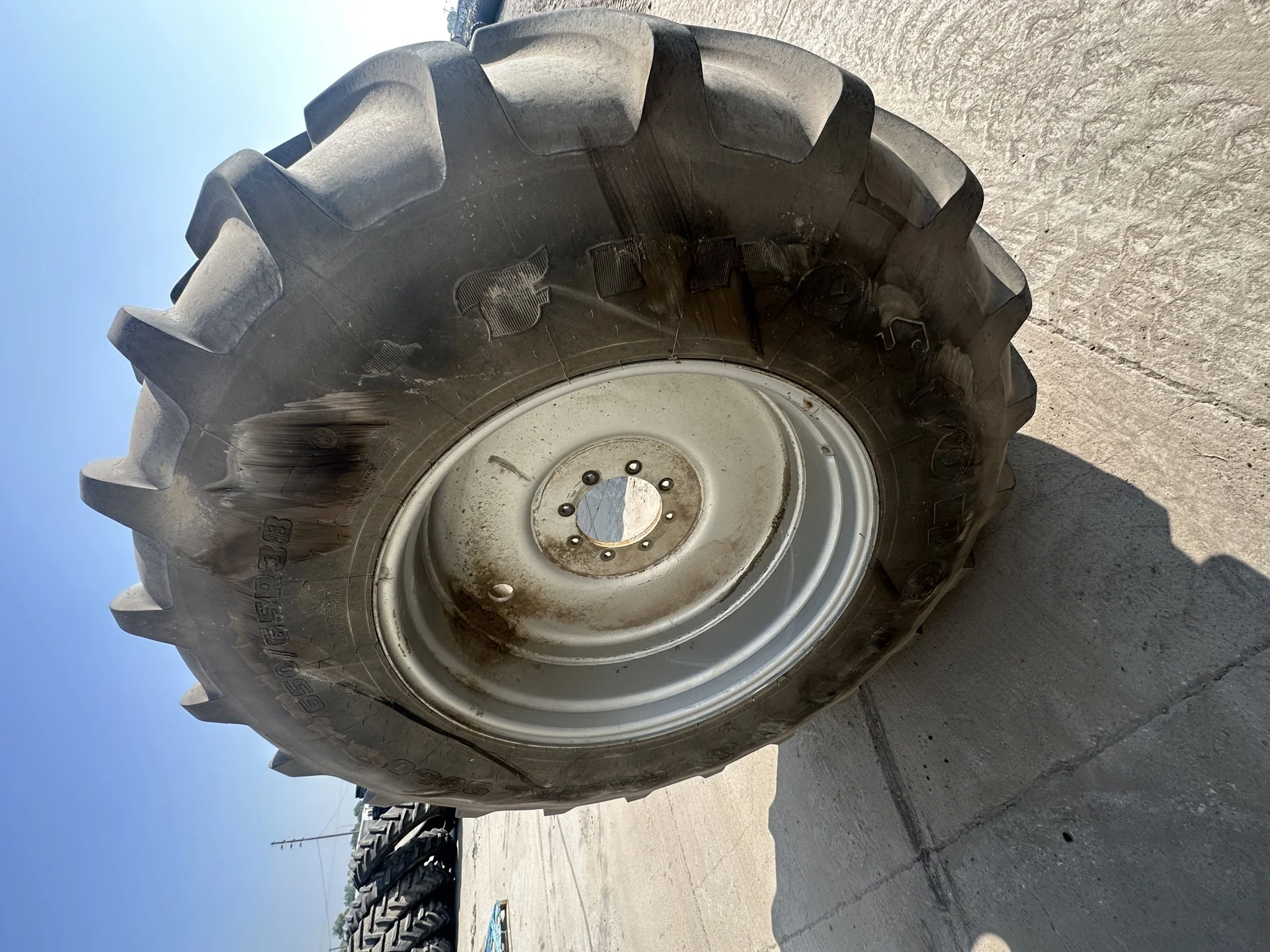Used 90% 650/65R38 Firestone Radial 9000 R-1W (166D) on 23 x 38 Silver 8 Bolt Sprayer Wheel