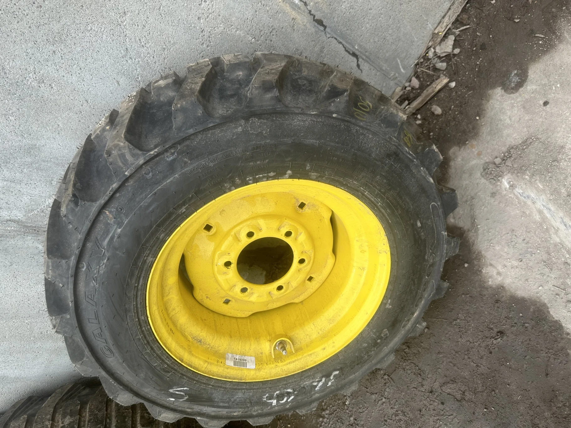TAKE OFF 10-16.5 Galaxy XD2010 R-4 C(6Ply) TL on a 8.25 X 16.5 JD Yellow 6 Bolt Implement Whee