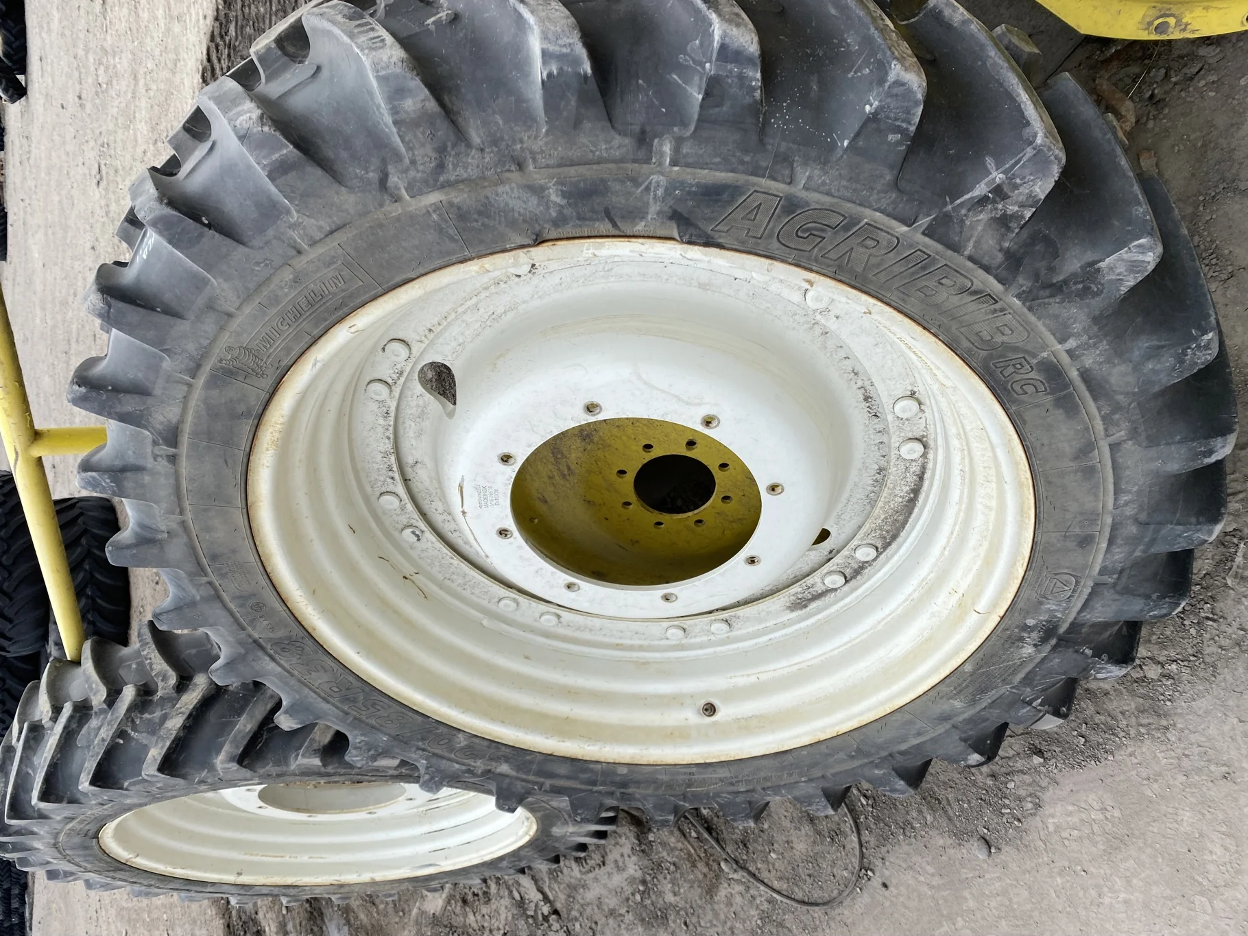 Used 70% 320/85R38 Michelin AgriBib Row Crop R-1W (143A8/143B) TL on a 10 x 38 New Holland White Waf