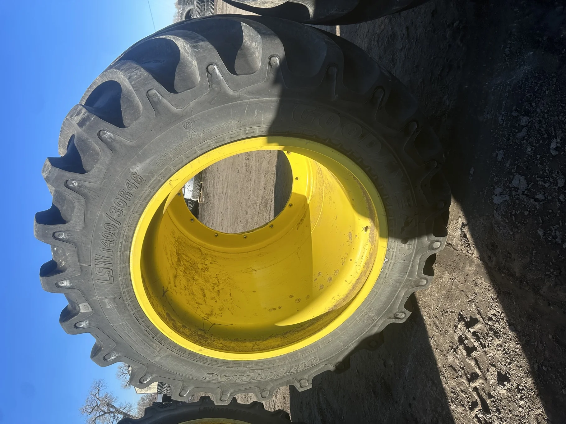 Used 90% LSW 1400/30R46 Goodyear Optitrac R-1W (201D) on a 32 x 46 JD Yellow 12 Bolt Stub Disc