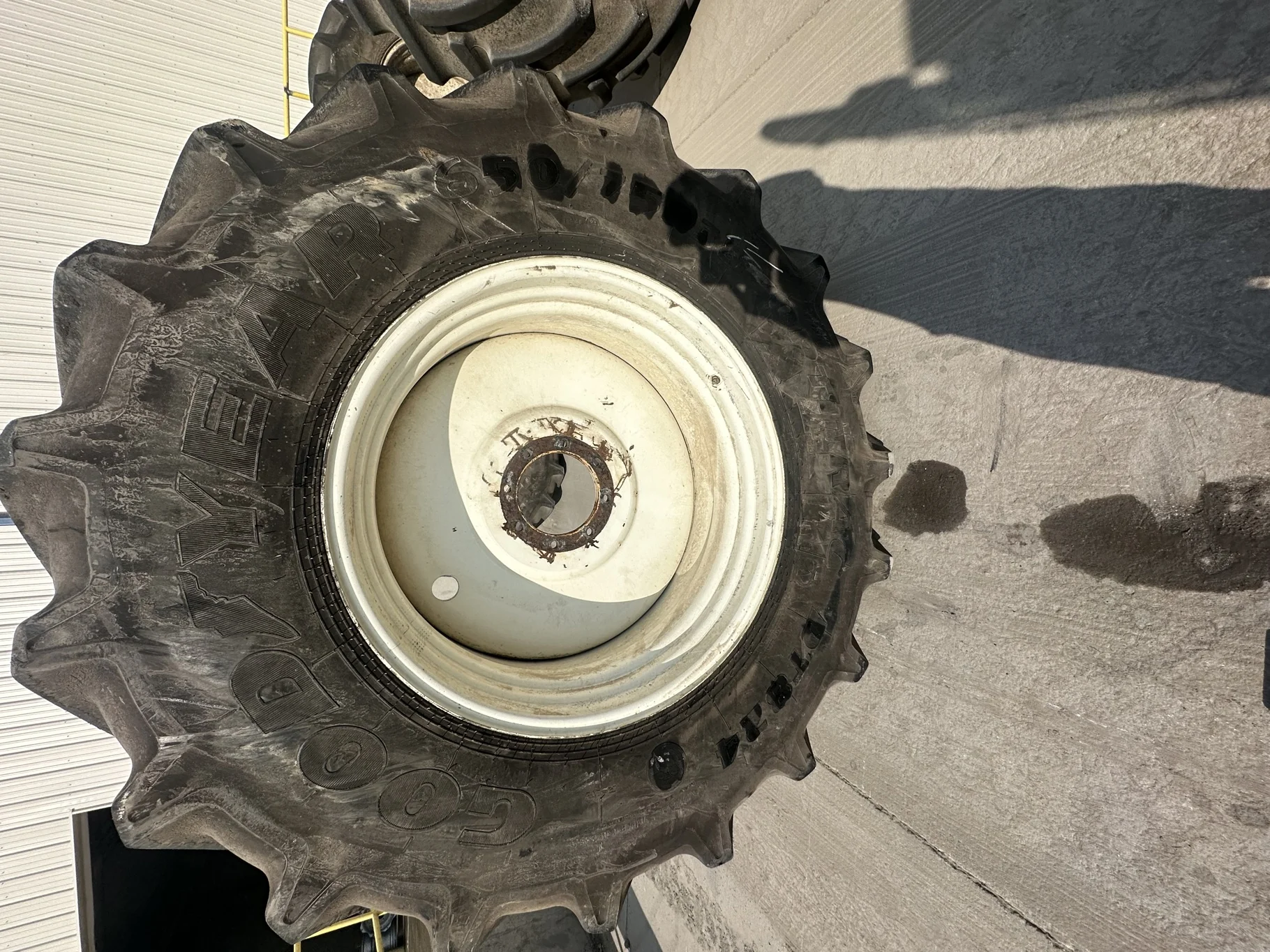 Used 90% 650/75R38 Goodyear Optitrac R-1W (169A8/B) TL on a 23 x 38 NH White 8 Bolt (.844) Sp image 2