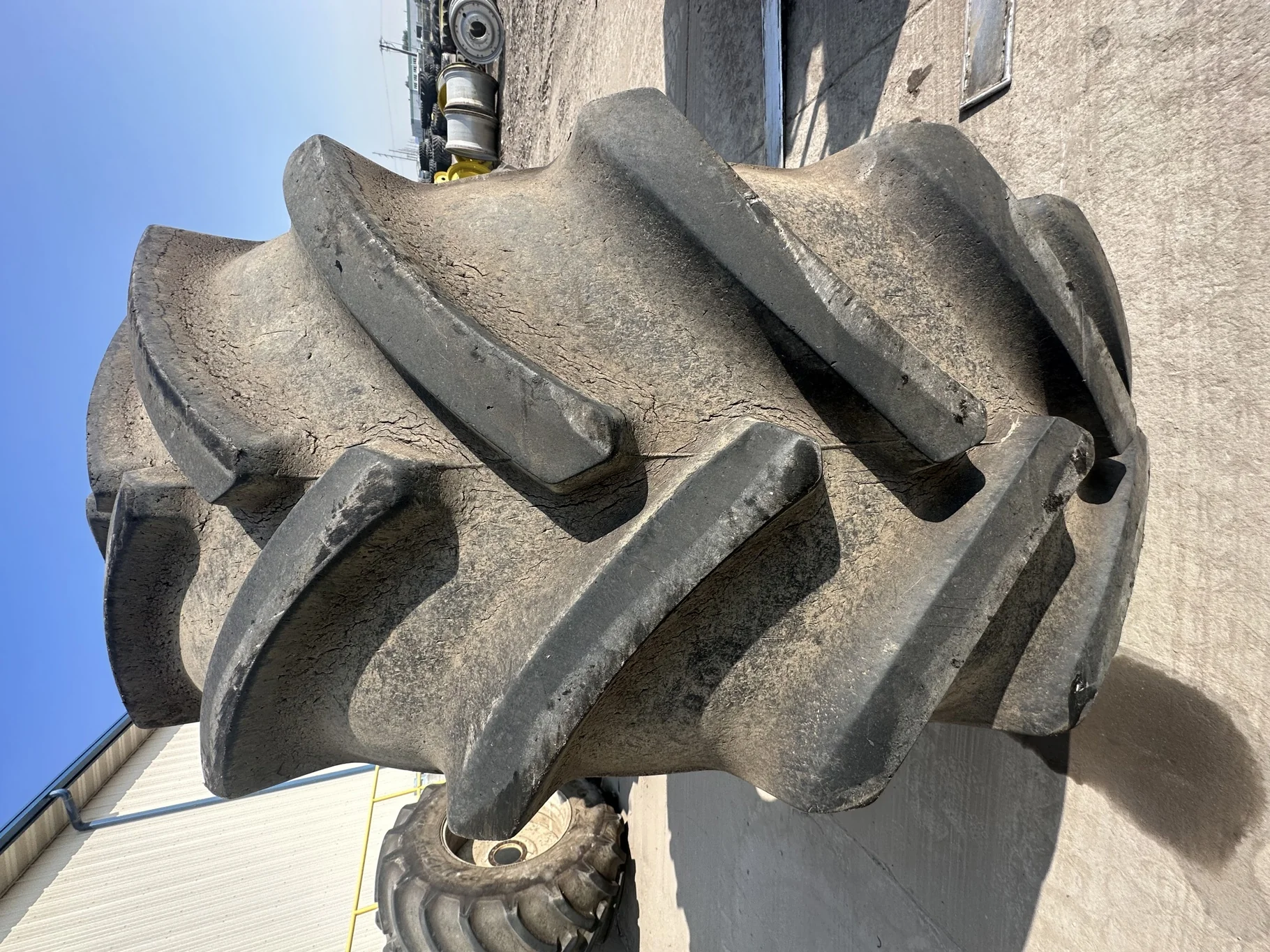 Used 90% 650/75R38 Goodyear Optitrac R-1W (169A8/B) TL on a 23 x 38 NH White 8 Bolt (.844) Sp image 4