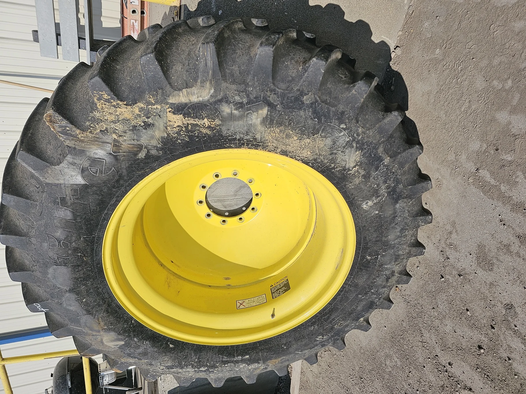 Used 80% 520/85R42 Firestone Radial All Traction 23 R-1W (157B) TL on 18 x 42 John Deere Yellow 10