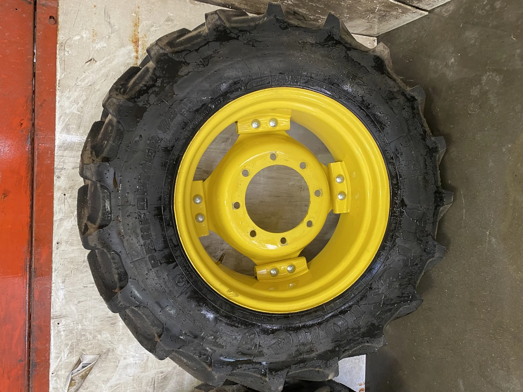 Used 85% 320/85R24 Firestone Performer 85 R-1W (122D) TL on a 10 x 24 John Deere Yellow 8 Bolt 6 Lo image 2