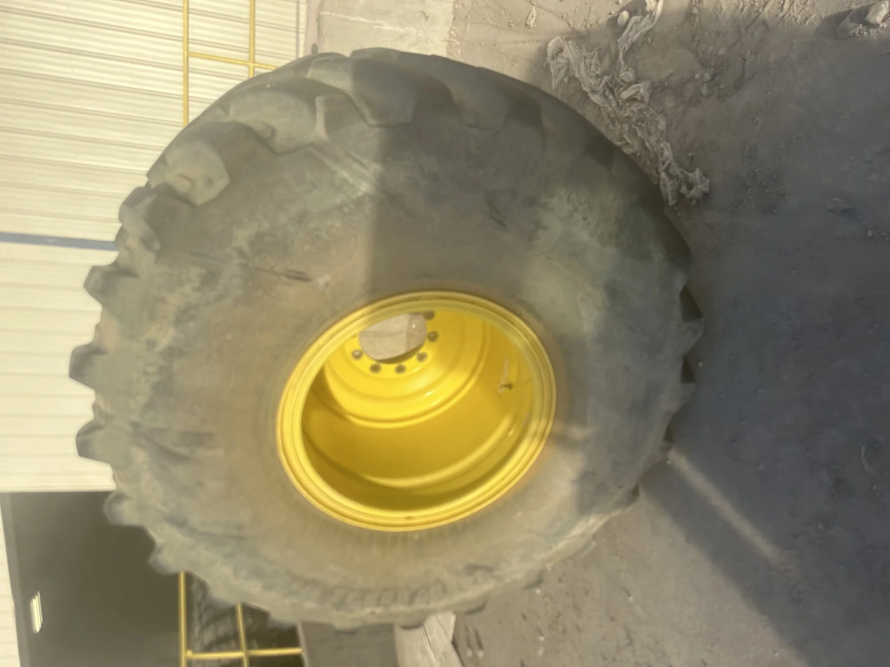 Used 90% IF1250/50R32 CFO Firestone Radial Deep Tread 23 R-1W (201B) TL on a 44 x 32 JD Yello