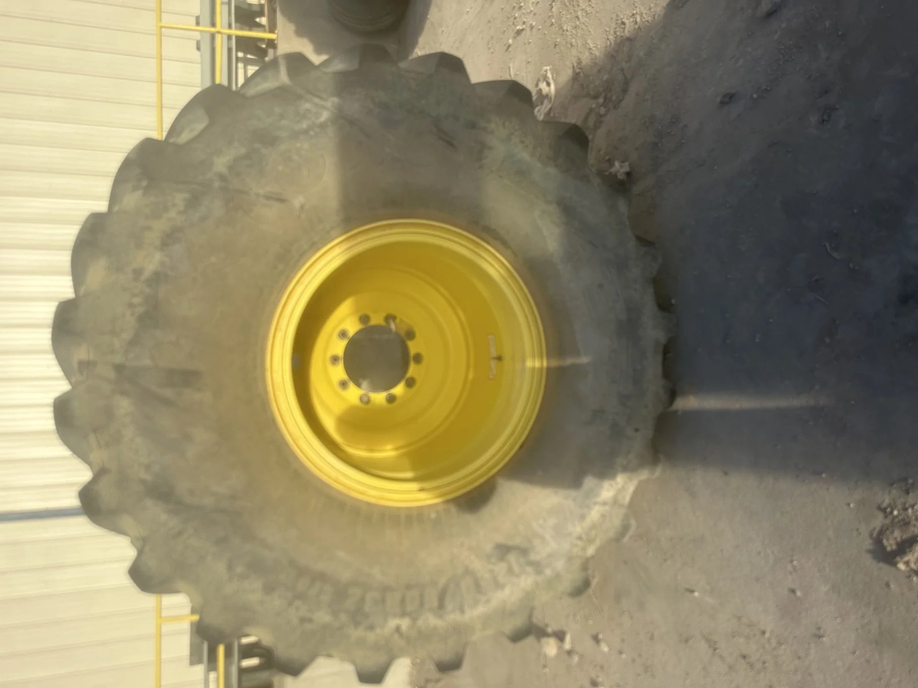 Used 90% IF1250/50R32 CFO Firestone Radial Deep Tread 23 R-1W (201B) TL on a 44 x 32 JD Yello image 2