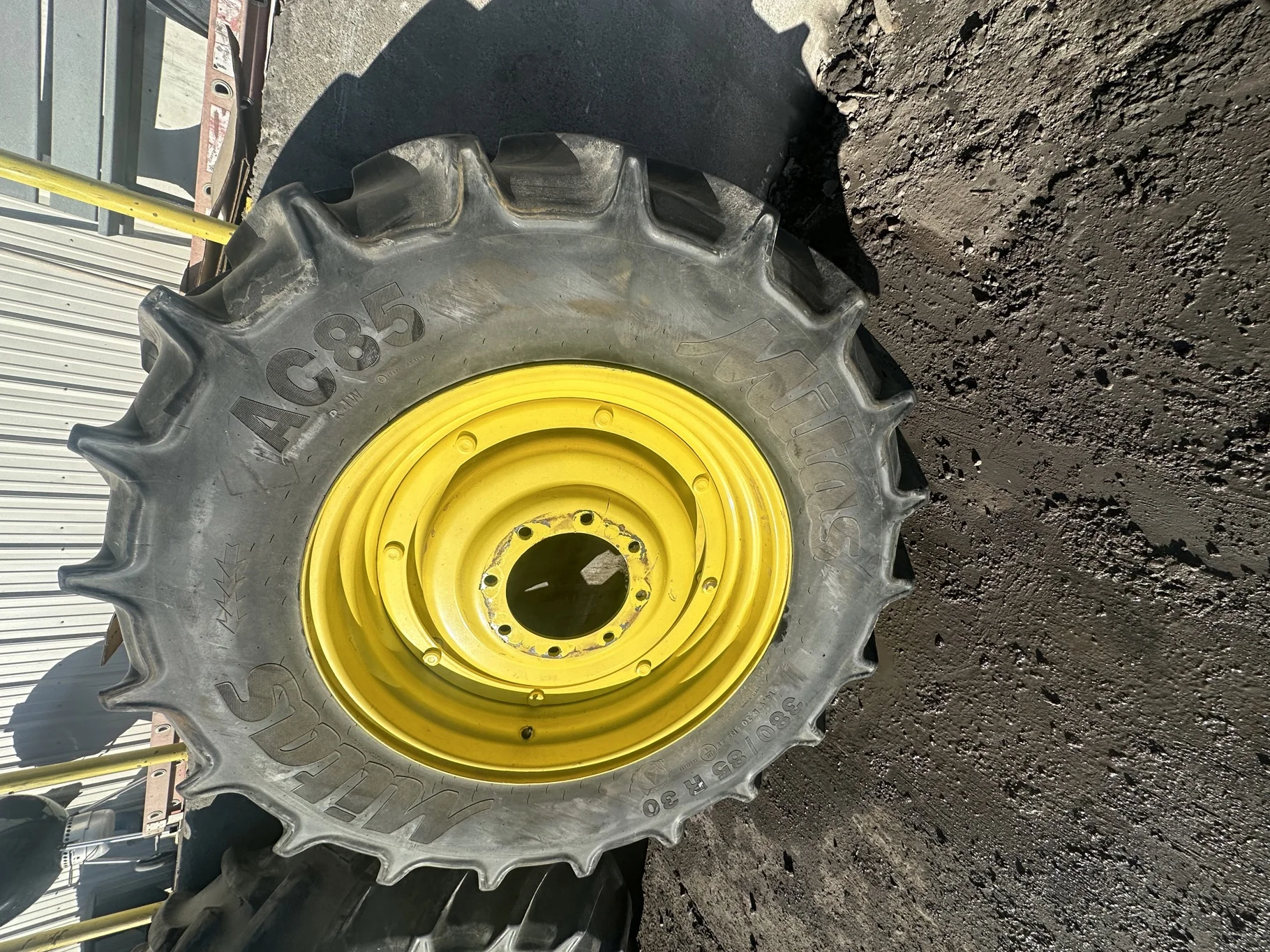 Used 80% 380/85R30 (14.9R30) Mitas AC85 135A8/135B TL on a 12 x 30 JD Yellow 8 Bolt Stub Disc