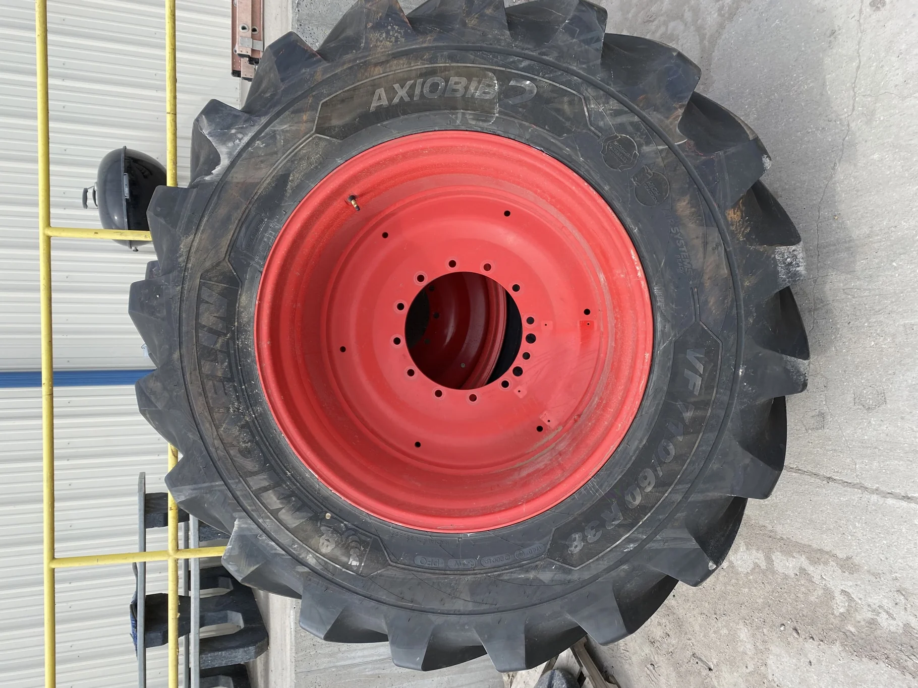 Used 95% VF710/60R38 Michelin AxioBib2 R-1W 174D TL on a 25 x 38 Fendt Red 12 Bolt (.906") Straight