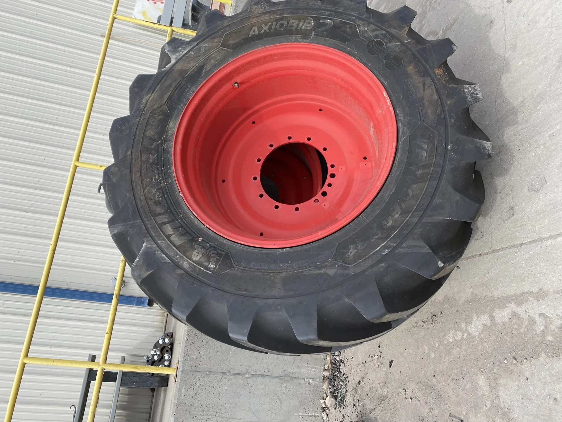 Used 95% VF710/60R38 Michelin AxioBib2 R-1W 174D TL on a 25 x 38 Fendt Red 12 Bolt (.906") Straight image 2
