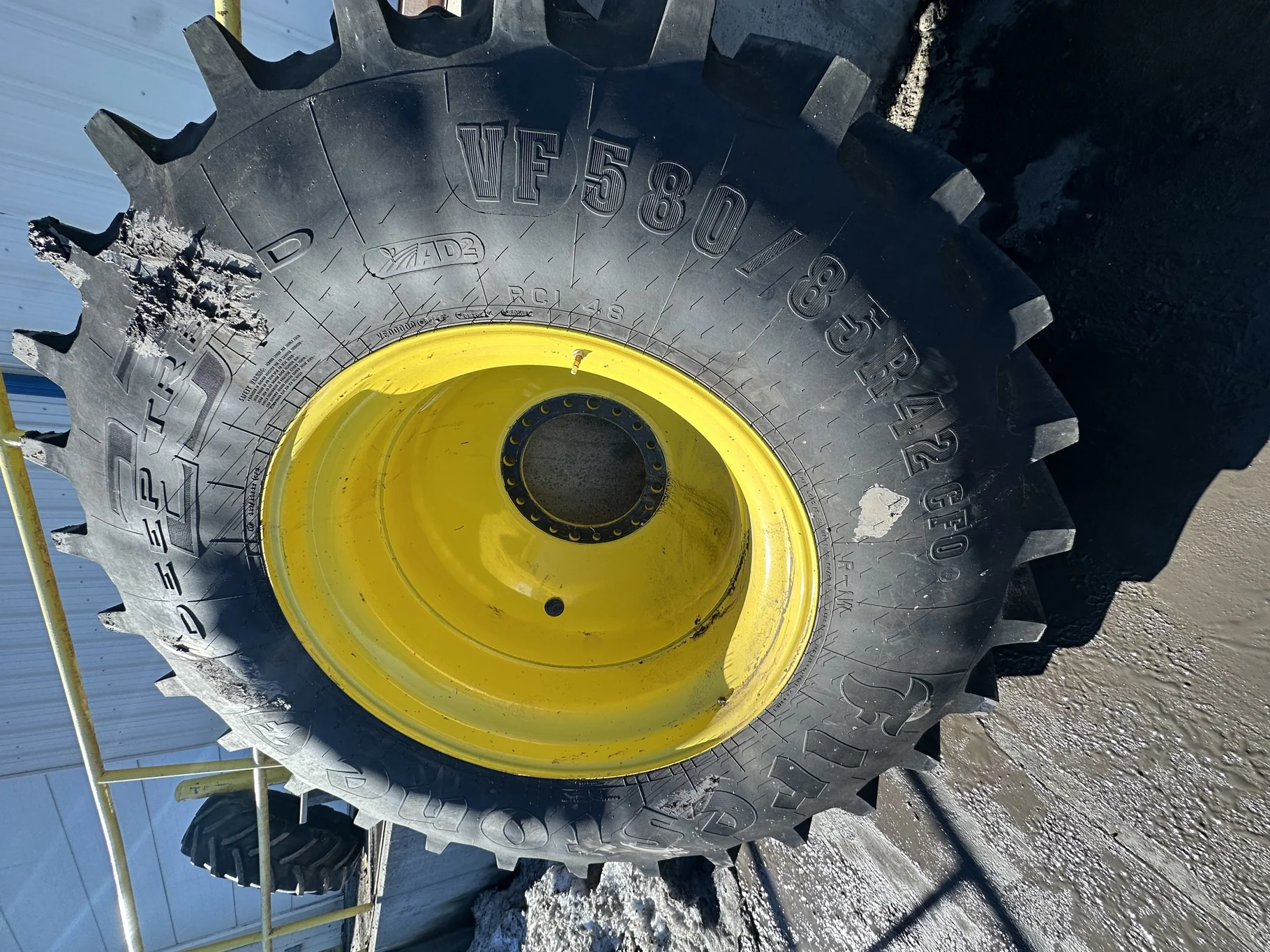 Used 95% VF580/85R42 CFO Firestone Radial Deep Tread 23 R-1W 178B TL on a 18 X 42 XE Series  JD