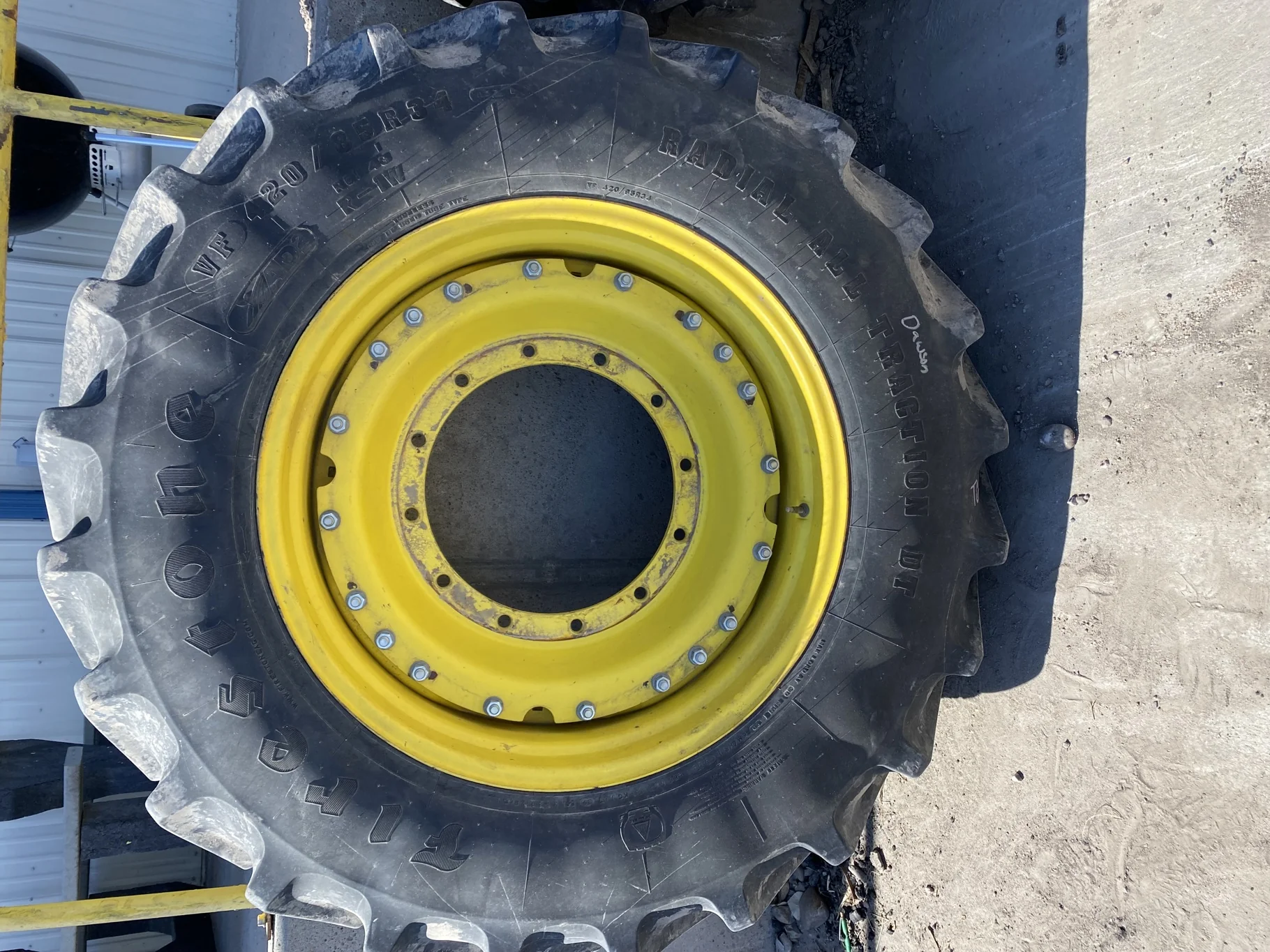 Used 90% VF420/85R34 Firestone Radial All Traction DT R-1W 157B TL on a 15 x 34 JD Yellow Waffle