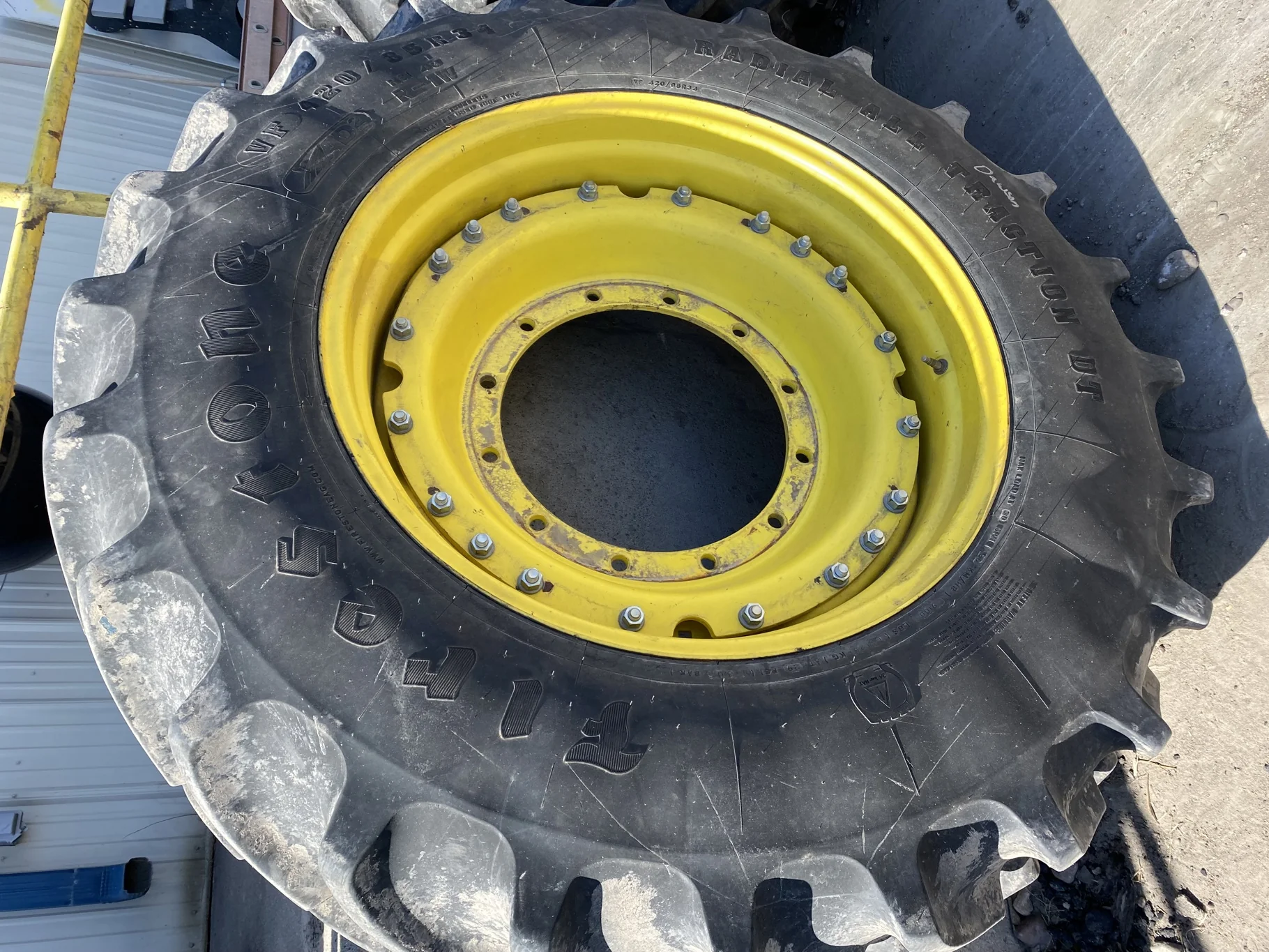Used 90% VF420/85R34 Firestone Radial All Traction DT R-1W 157B TL on a 15 x 34 JD Yellow Waffle image 2