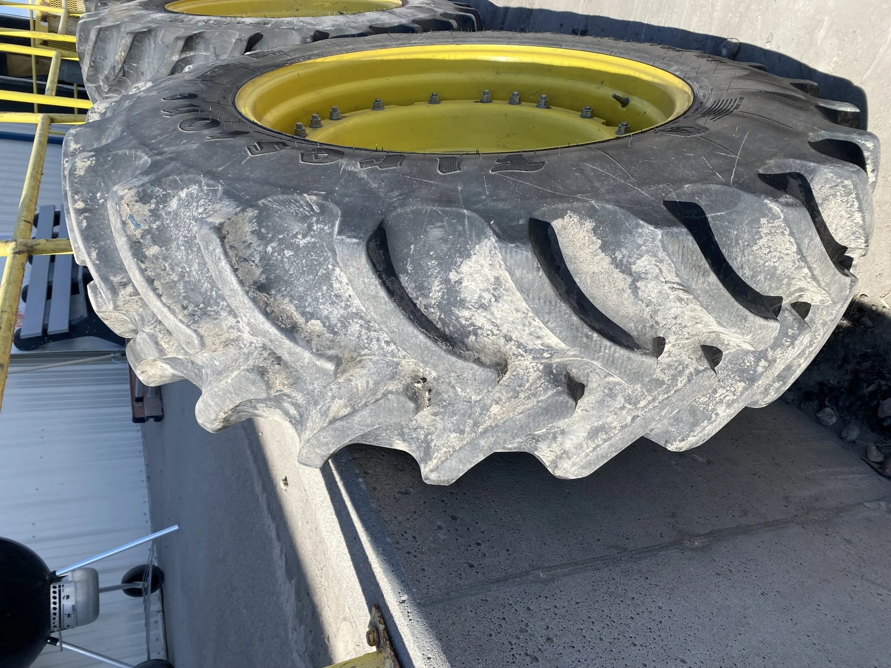 Used 90% VF420/85R34 Firestone Radial All Traction DT R-1W 157B TL on a 15 x 34 JD Yellow Waffle image 3