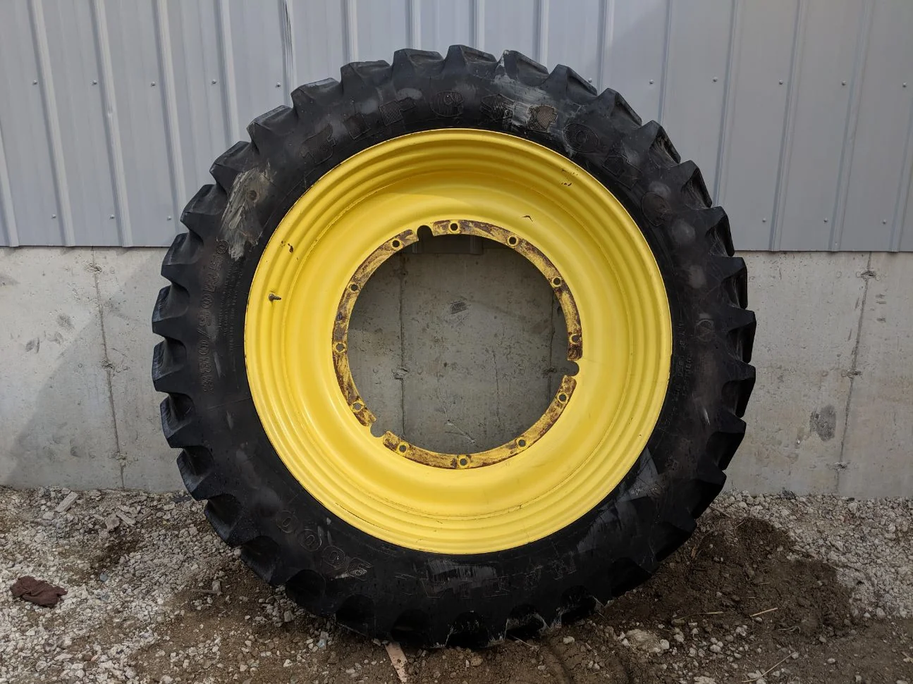 Used 85% 380/90R50 Firestone Radial 9000 R-1W 151B on a 12 x 50 JD Stub Disc- lug cuts