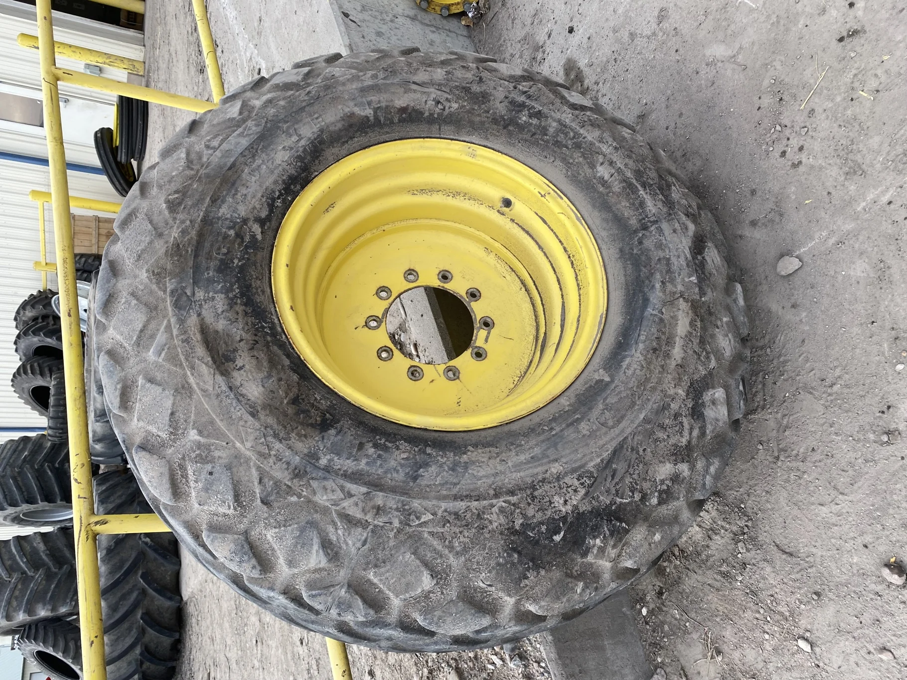 USED 45% 23.1-26 Goodyear All Weather 10 ply Mounted on 20 x 26 John Deere Yellow 10 Bolt Rim (10-1