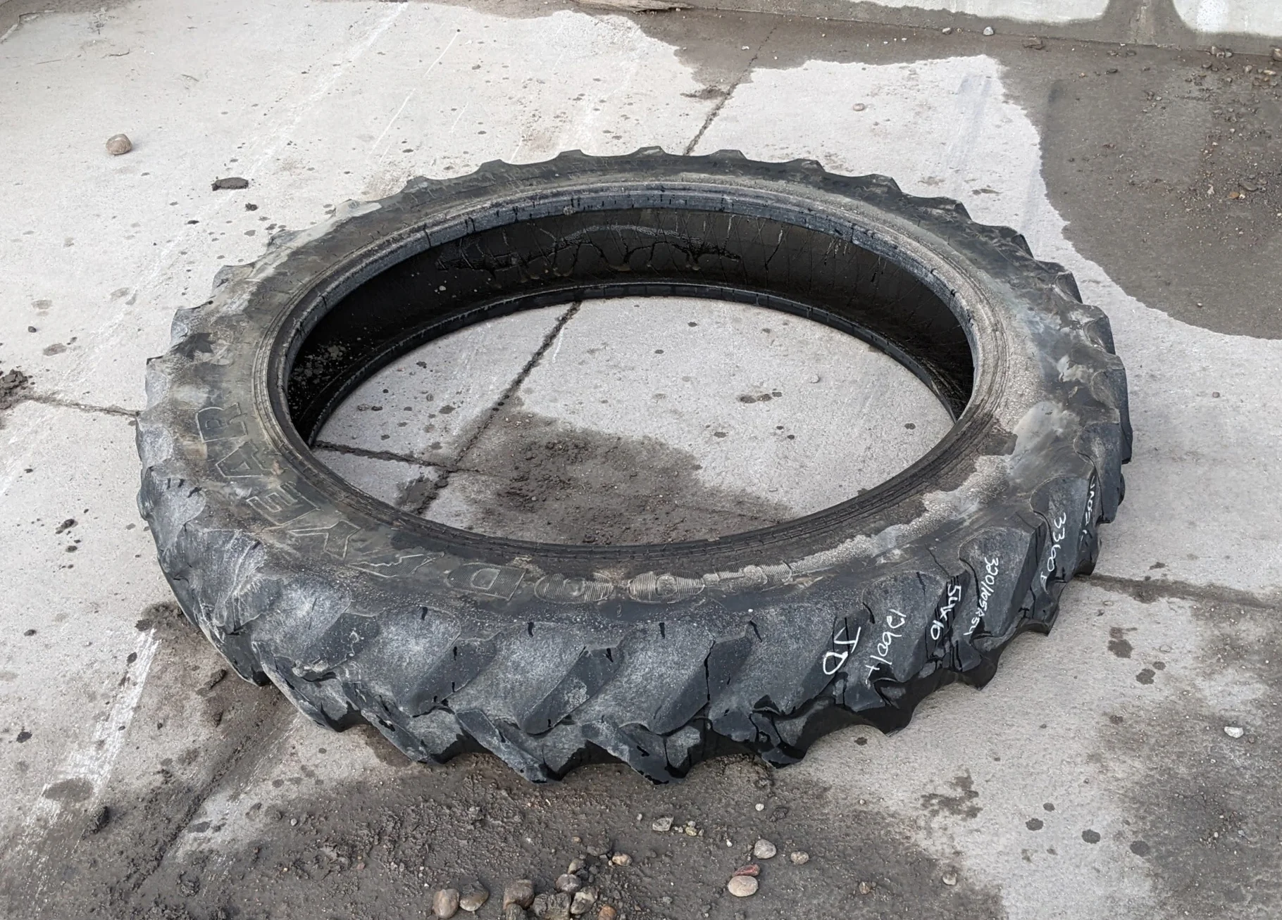 Used 40% 320/80R42 Titan 49V R-1W (141B) TL (uneven road wear, minor stubble forming on top of lugs)