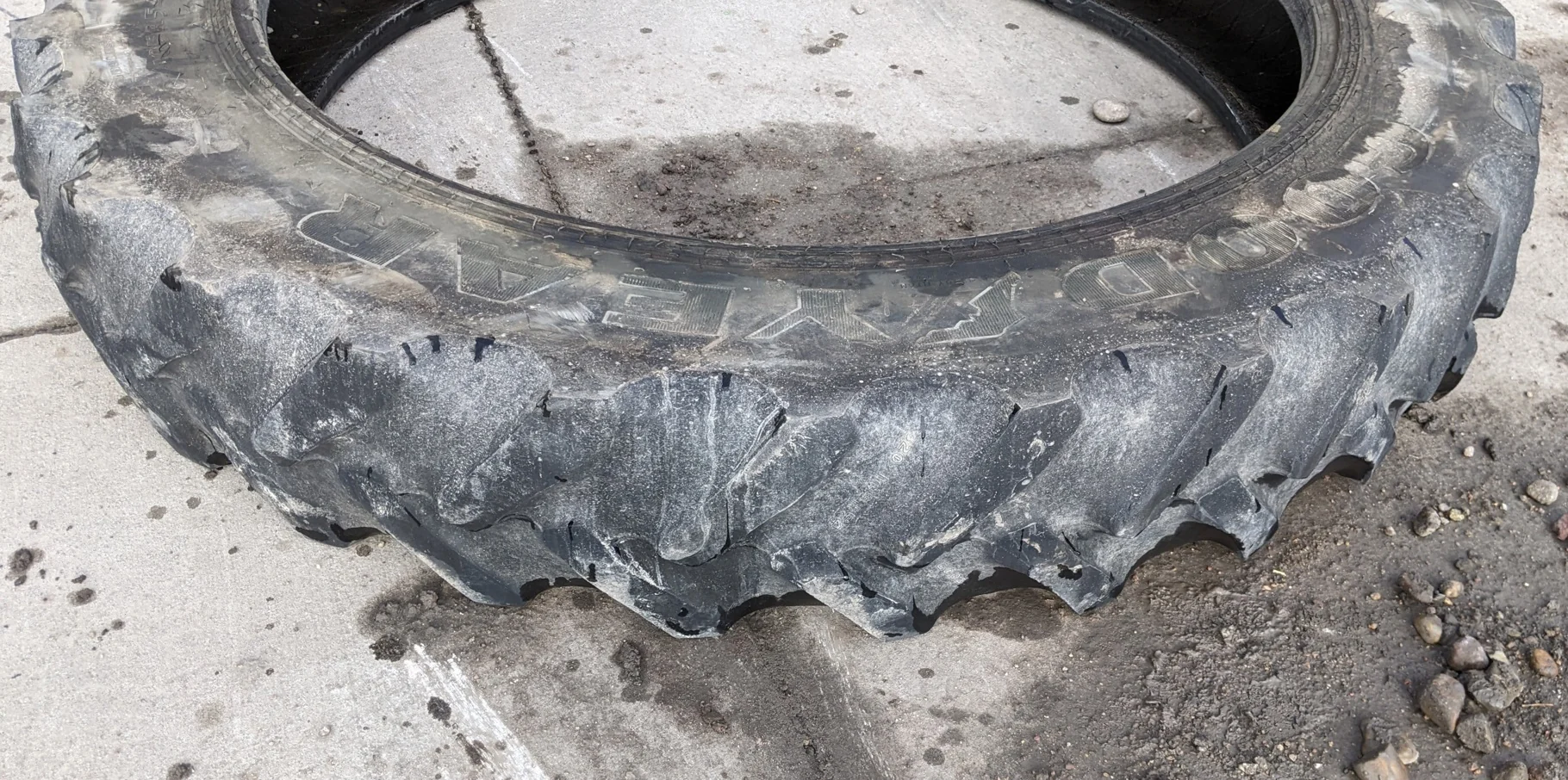 Used 40% 320/80R42 Titan 49V R-1W (141B) TL (uneven road wear, minor stubble forming on top of lugs) image 2