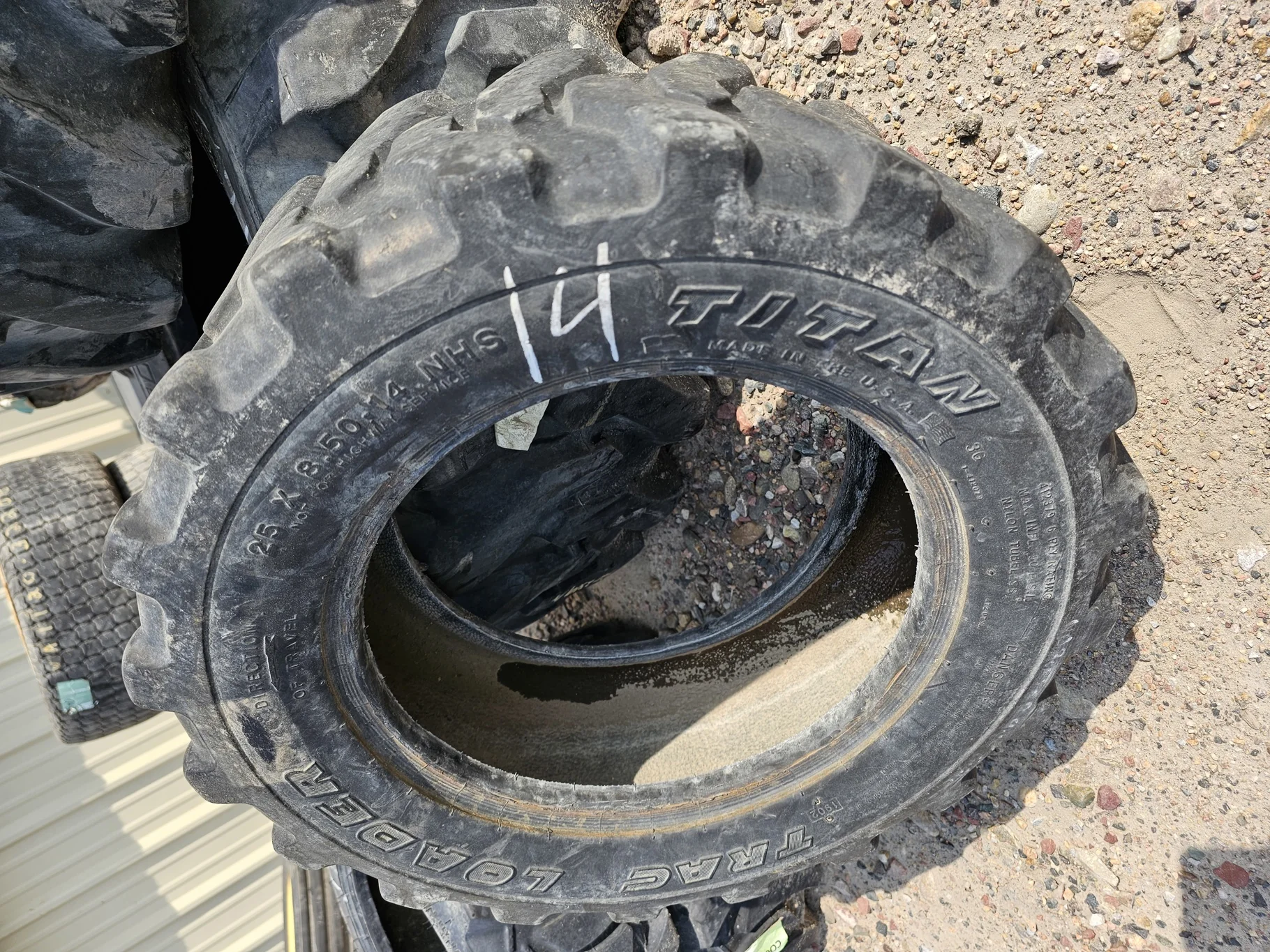 Used 50% 25x8.50-14 Titan Trac Loader R-4 6 Ply - Fair Condition (Lug Cuts, Road Wear, Bead