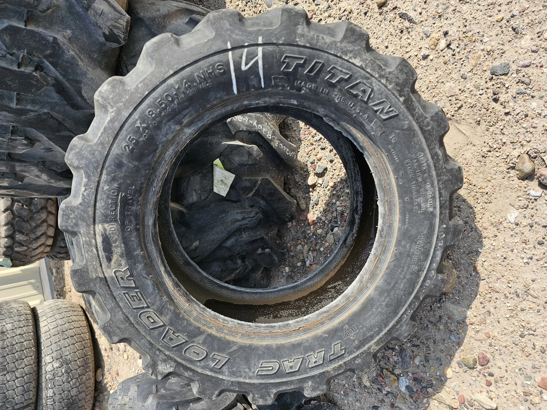 Used 50% 25x8.50-14 Titan Trac Loader R-4 6 Ply - Fair Condition (Lug Cuts, Road Wear, Bead image 2