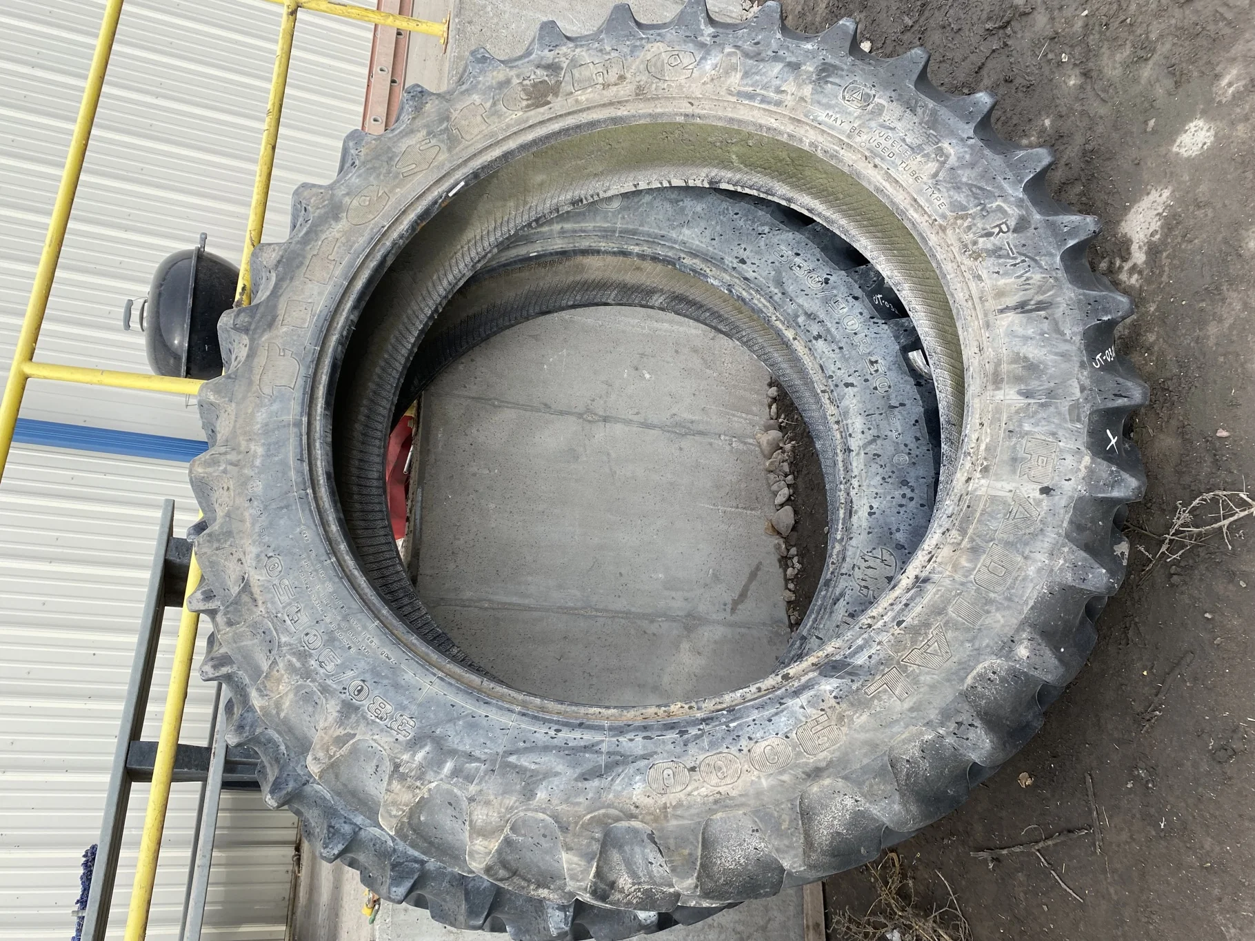 Used 85% 380/90R50 Firestone Radial 9000 R-1W (151A8) TL   _x000D_
(Lug Cuts, Chunks Missing, Cuts B