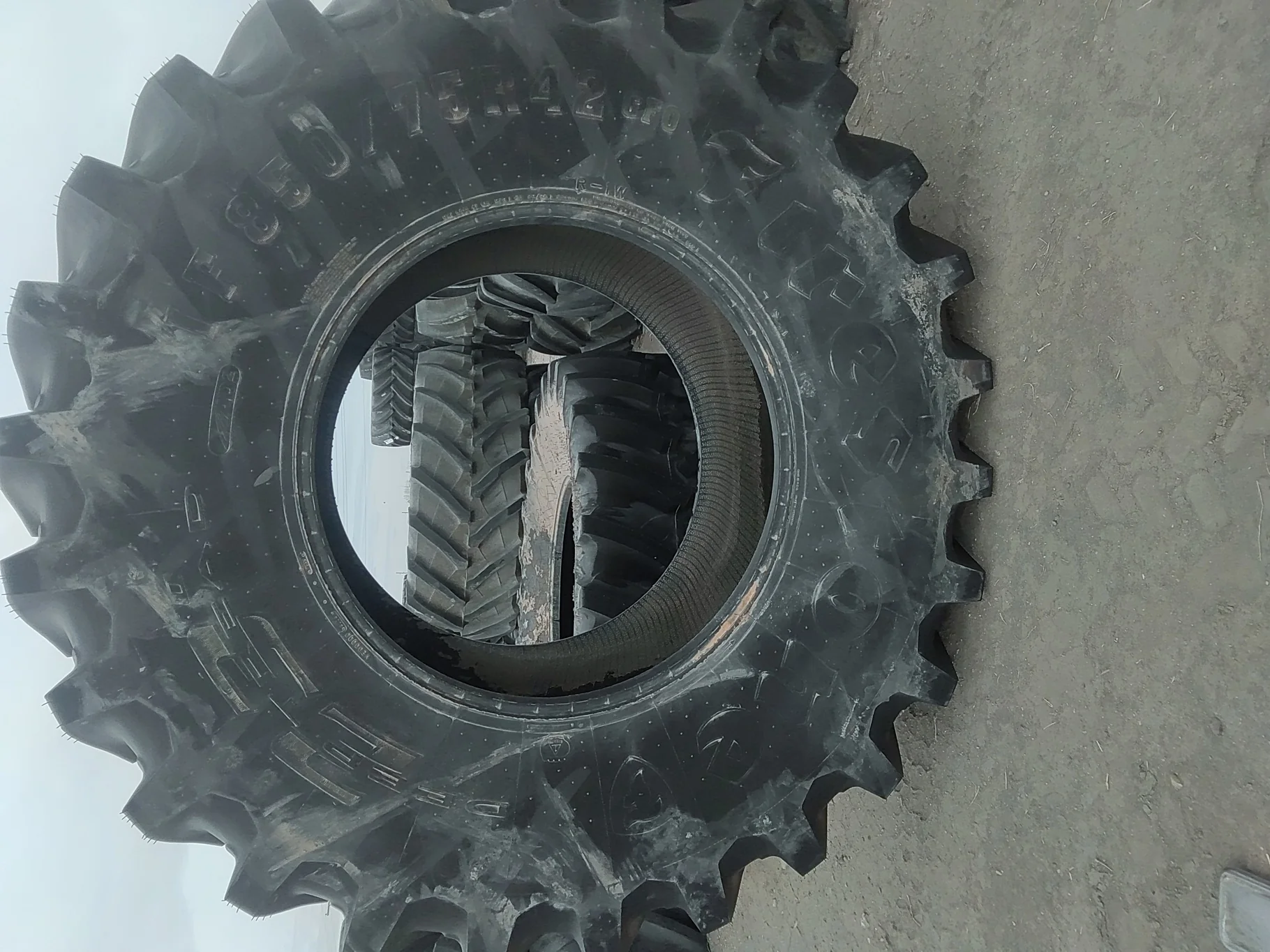 Used 100% IF850/75R42 CFO Firestone Radial Deep Tread 23 R-1W 186B TL - cuts on sidewall image 2