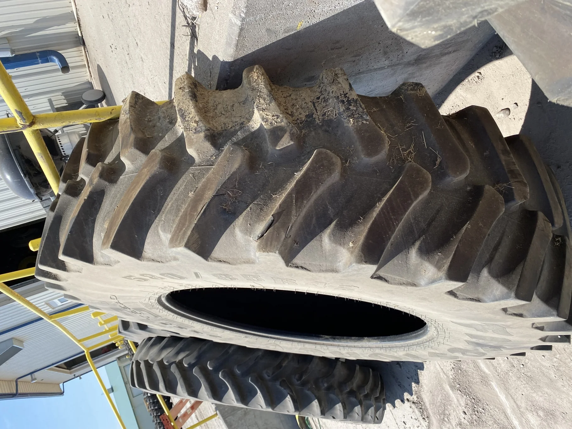 Used 75% 580/85R42 Firestone Radial Deep Tread 23 R-1W (166B) TL - Major Cut In Lug image 3