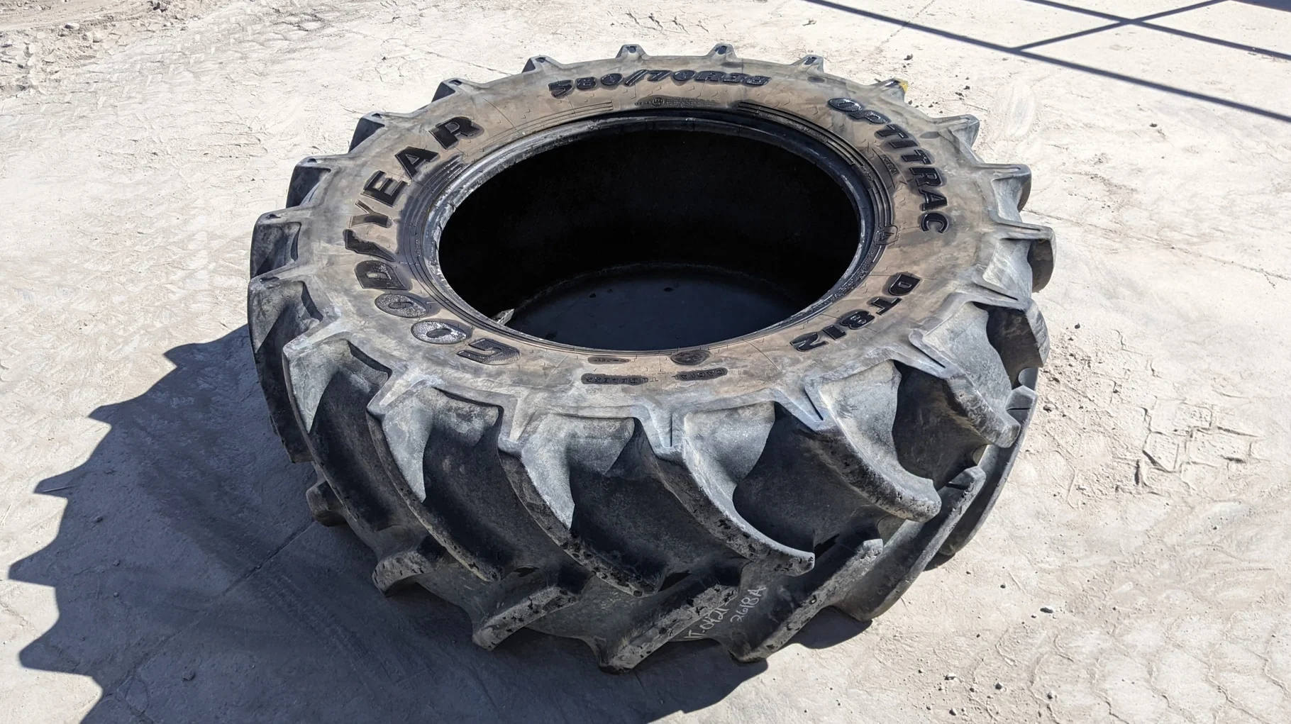 Used 85% 580/70R38 Goodyear Optitrac R-1W (155A8/152B) TL (Weathering cracks. Chunks missing from lu