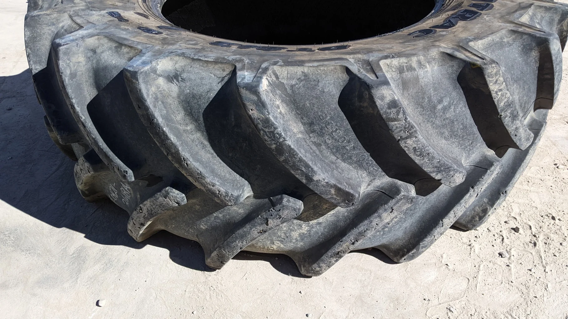 Used 85% 580/70R38 Goodyear Optitrac R-1W (155A8/152B) TL (Weathering cracks. Chunks missing from lu image 2