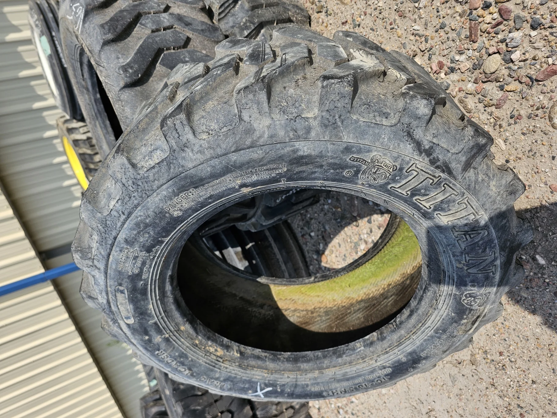 Used 65% 10-16.5NHS Titan Trac Loader Skid Steer C(6Ply) TL   _x000D_
(Lug Stubble)