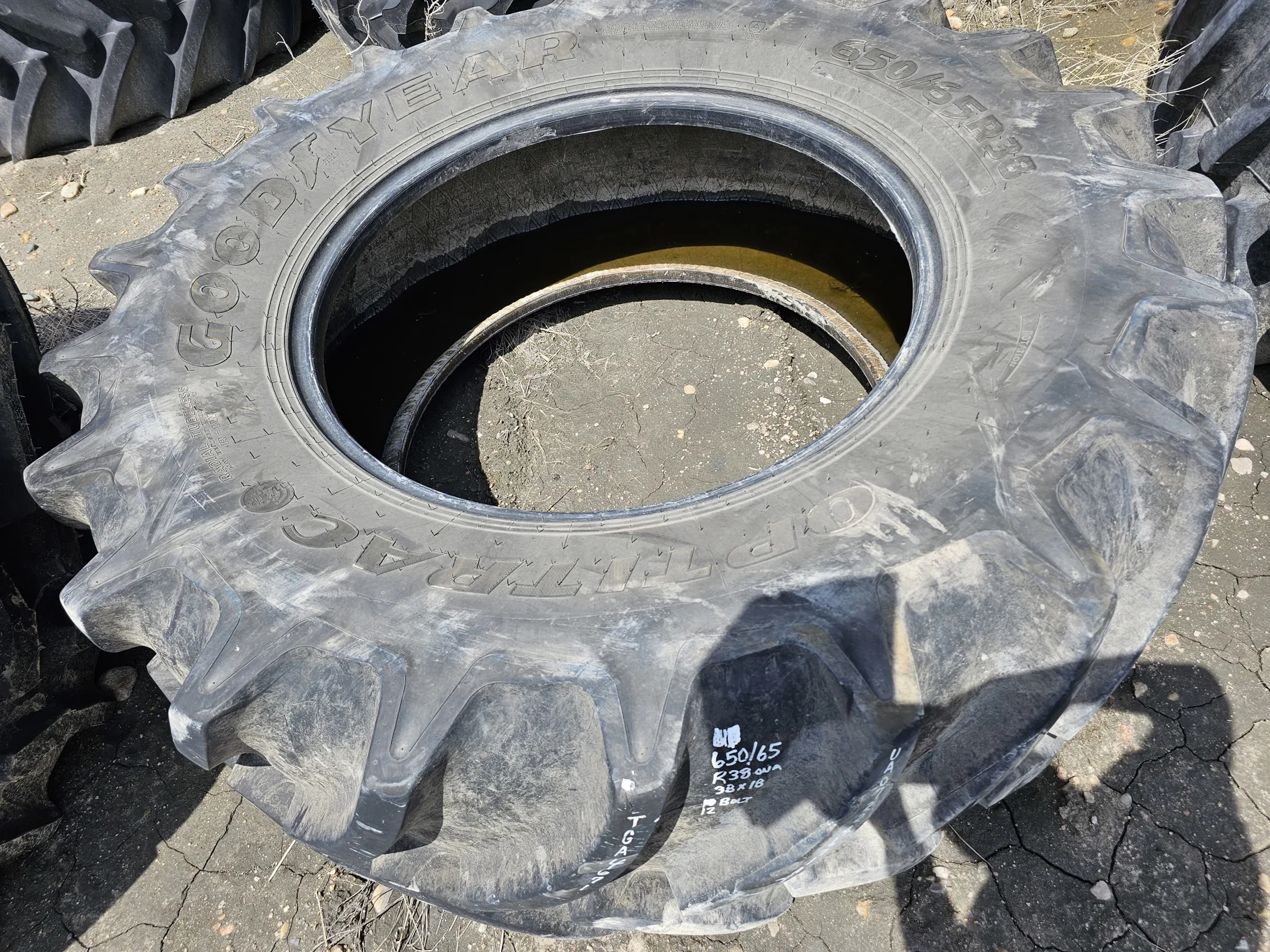 Used 90% 650/65R38 Goodyear Optitrac R-1W (166D) TL (Stubble, Lug Cuts, Slight Weathering) - Good Co image 2