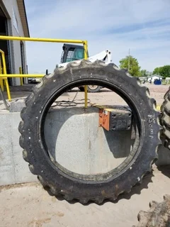 Used 60% 320/105R54 Goodyear Super Traction Radial - severe lug cuts