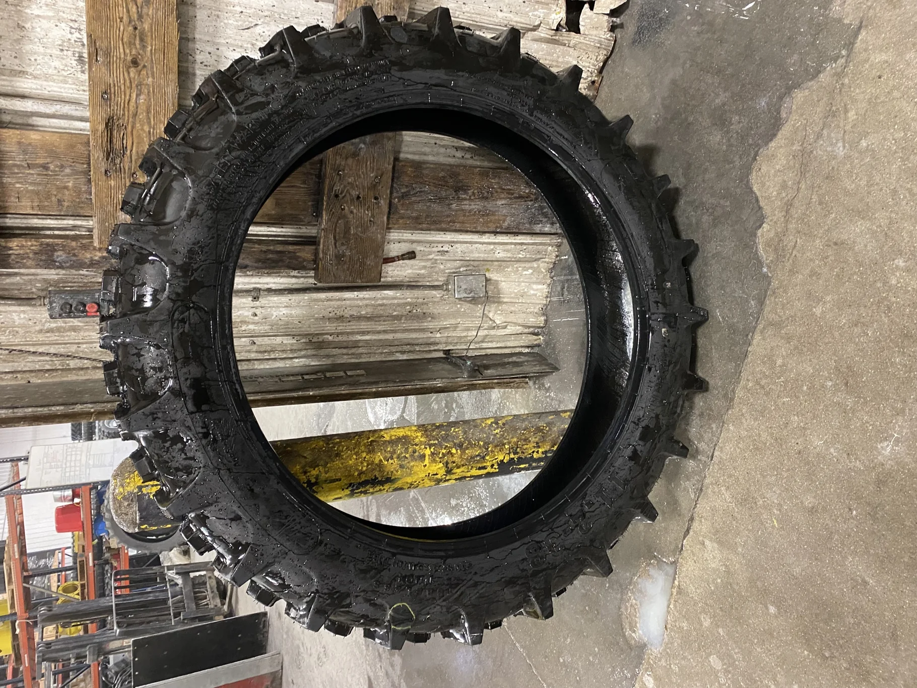 USED 100% 11.2-38 Farmboy Agri Storm 2  Has chunk missing out of tread