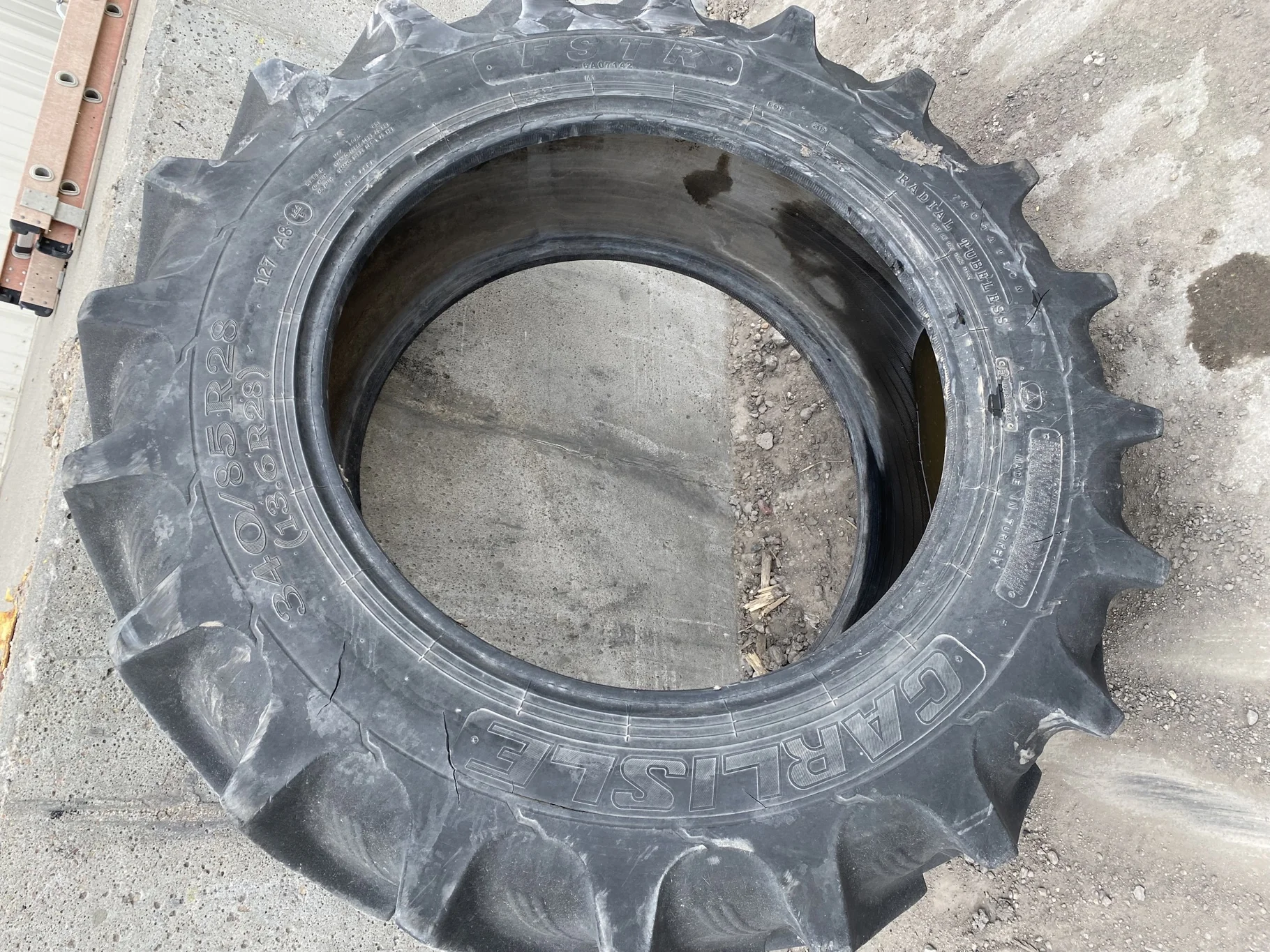 Used 70% 340/85R28 Carlise FSTR 127A8 TL (sidewall cuts, wreathing, road wear, lug cuts) image 2