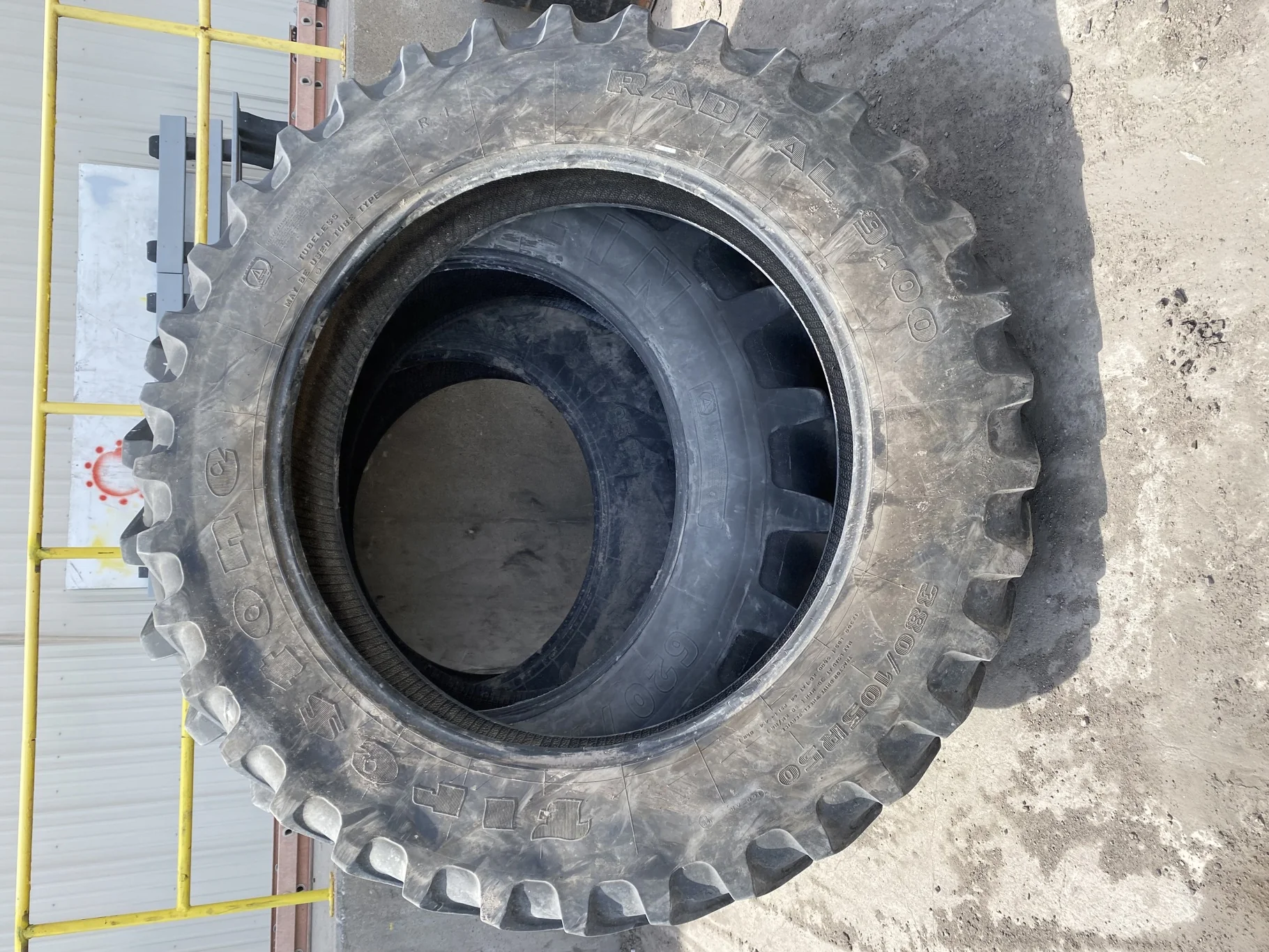 Used 69% 380/105R50 Firestone Radial 9100 168A8 R-1 TL (Road wear, lug stubble/cuts)