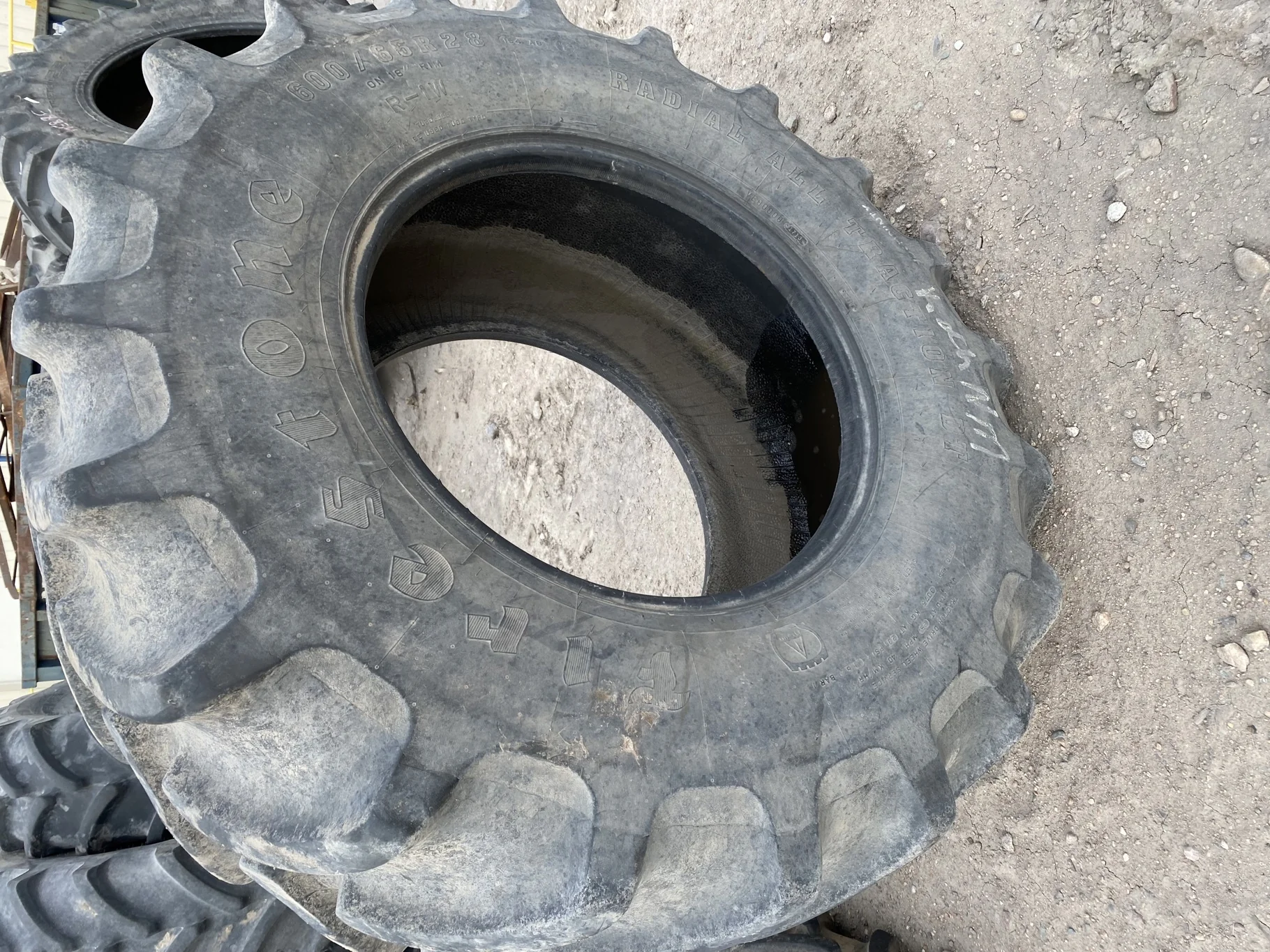 Used 66% 600/65R28 Firestone Radial All Traction DT 154A8 R-1W (Road wear, between tread cuts, sidew image 2