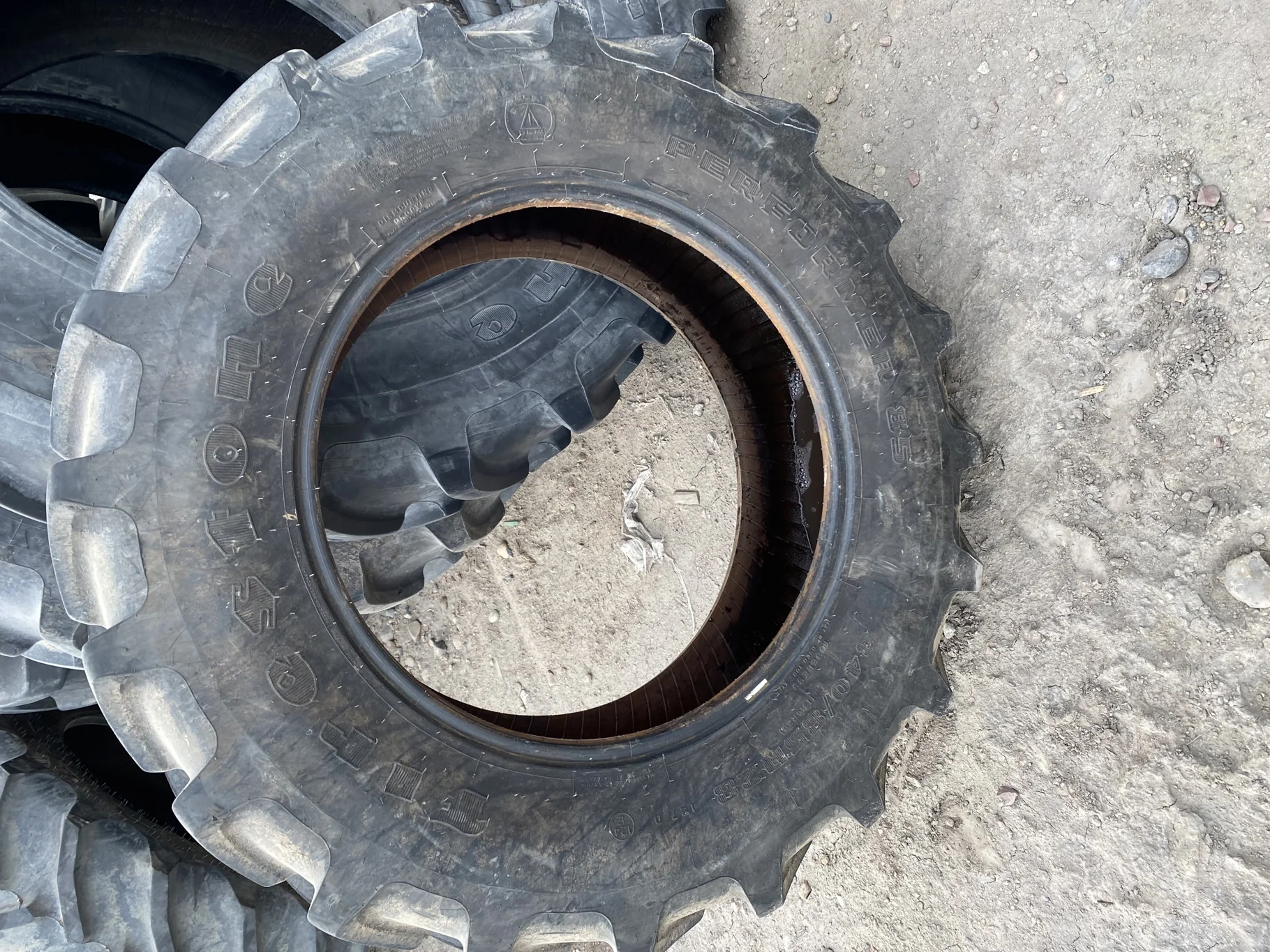 Used 90% 340/85R28 Firestone Performer 85 127D TL (lug cuts, chunks, stubble, weathering, between tr