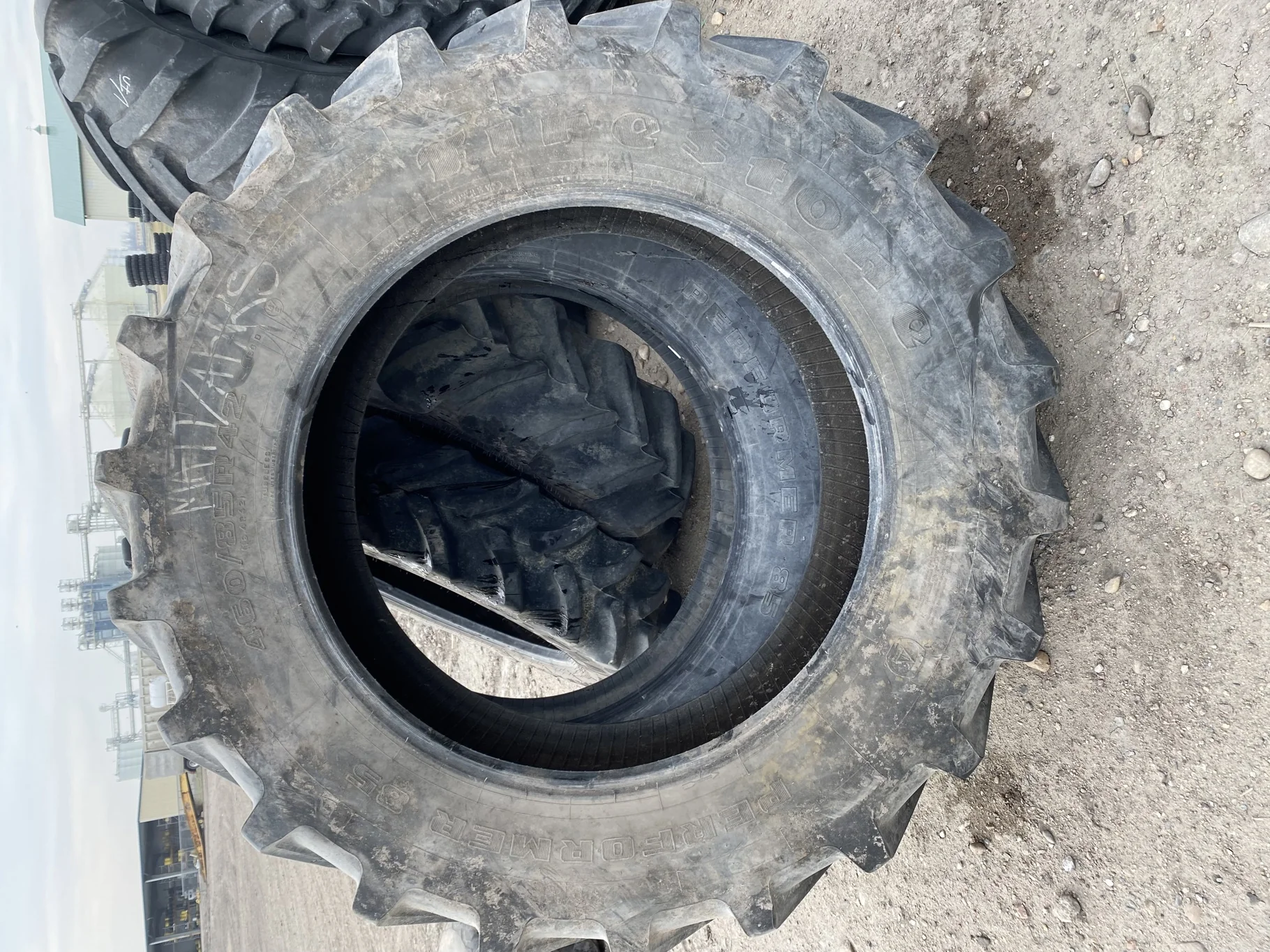 Used 82% 460/85R42 Firestone Performer 85 150D TL (heavy lug cuts / chunks between tread)