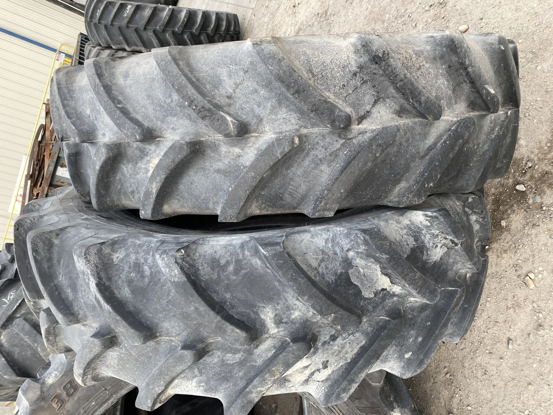 Used 82% 460/85R42 Firestone Performer 85 150D TL (heavy lug cuts / chunks between tread) image 2