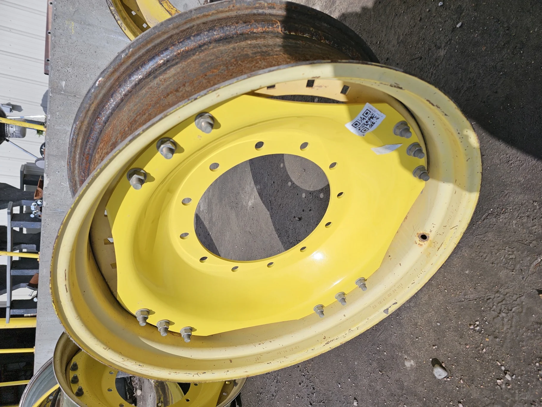 Used 13 X 34 John Deere Yellow Waffle Wheel (3 Bolt) (16-29.25) 8.25" BS with a 34" John Deere Yello