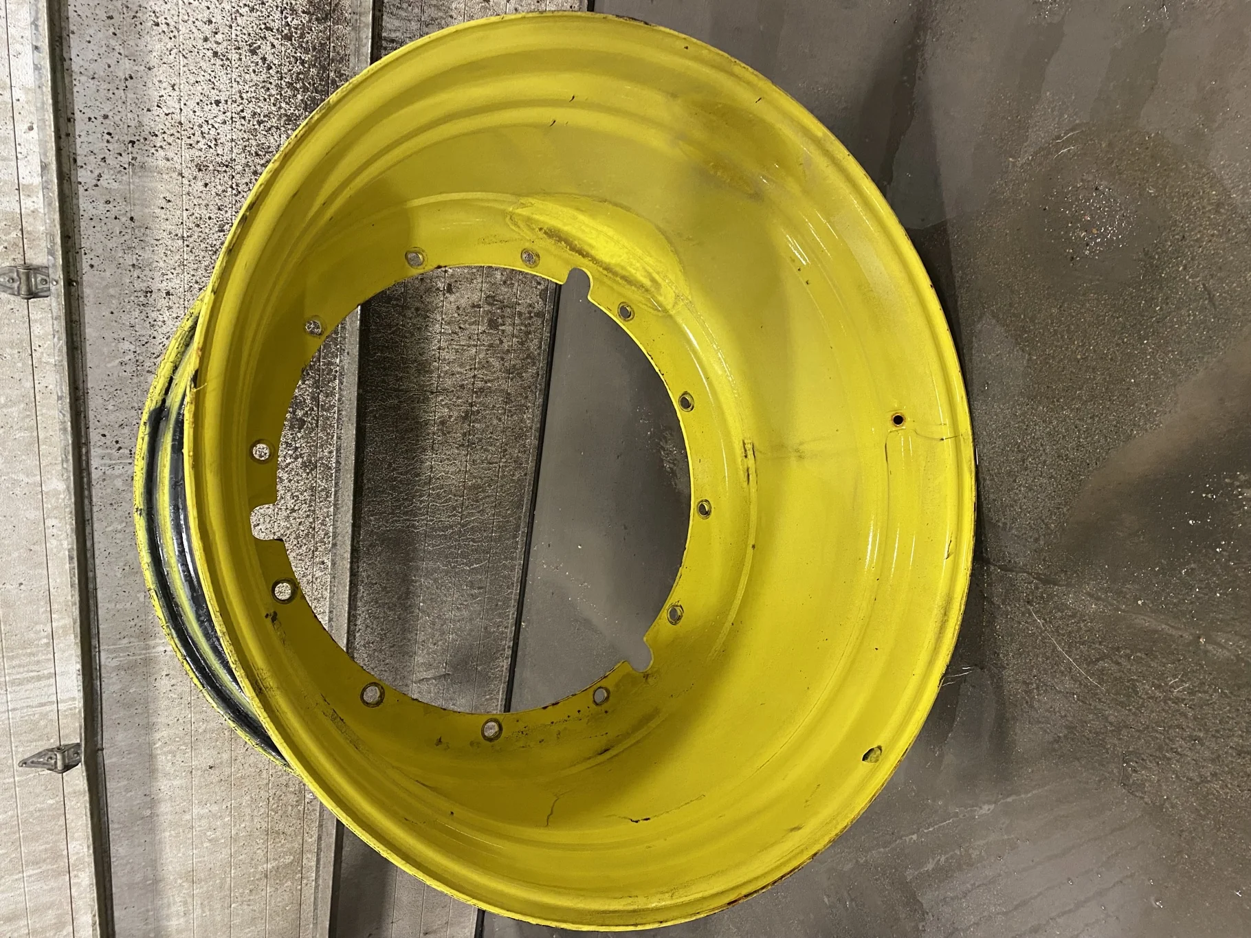 Used 23 X 42 John Deere Yellow 12 Bolt Sprayer Stub Disc (12-32.047-30.078) - Good Condition
