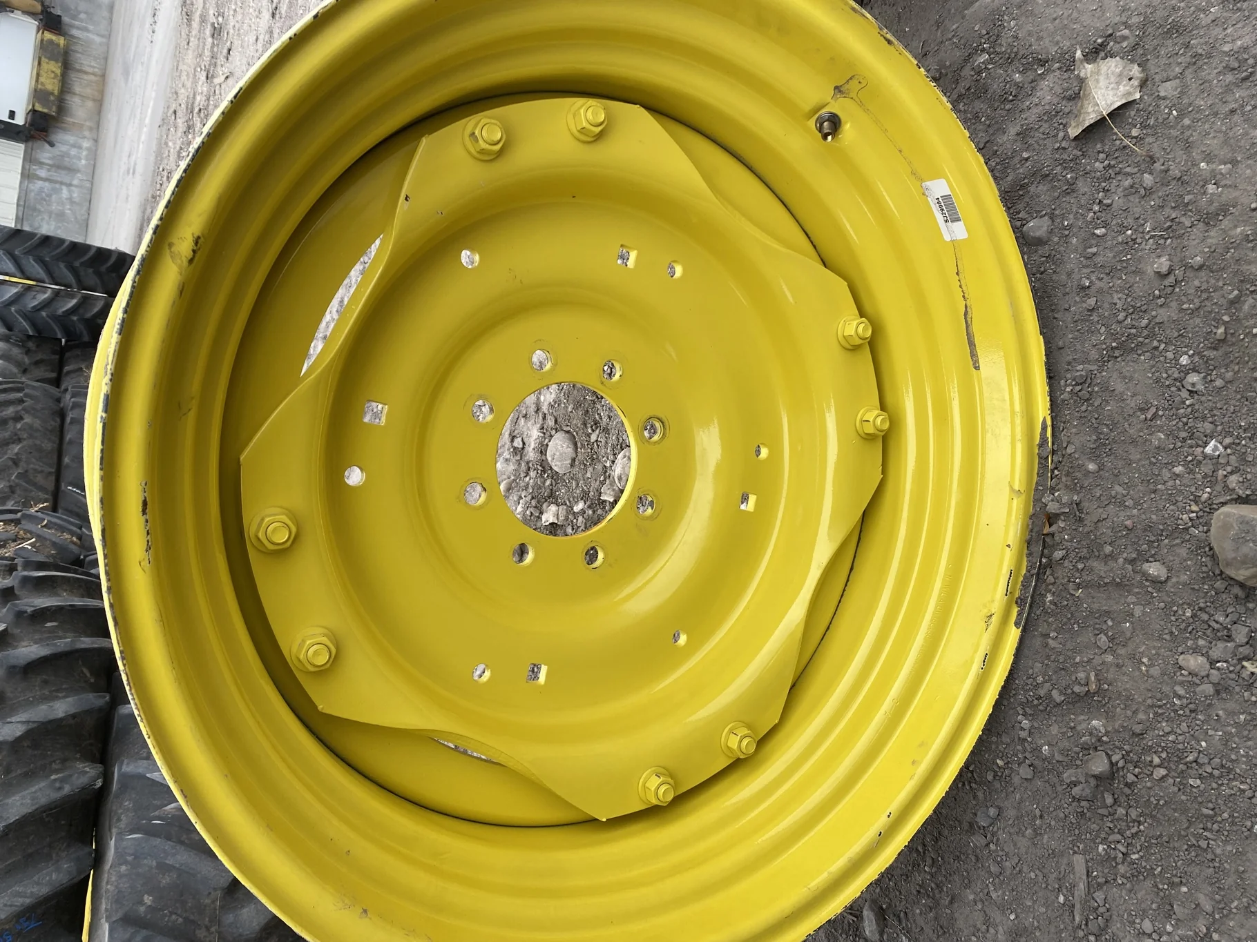 Used 15 X 30 John Deere Yellow Waffle Wheel (2 Bolt) (24-23.25) 9.5" BS with a 28/30" John Deere Yel image 2
