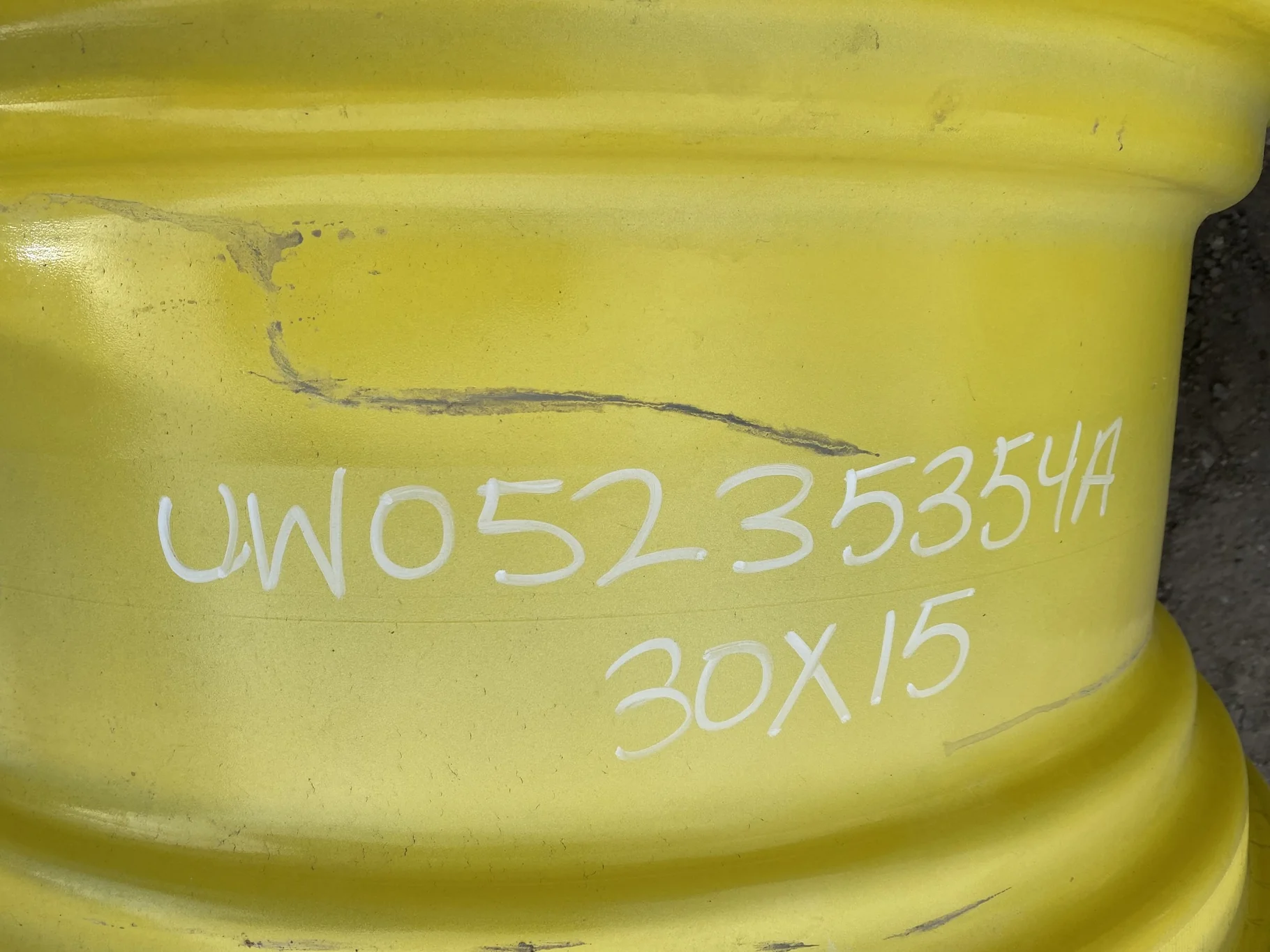 Used 15 X 30 John Deere Yellow Waffle Wheel (2 Bolt) (24-23.25) 9.5" BS with a 28/30" John Deere Yel image 5