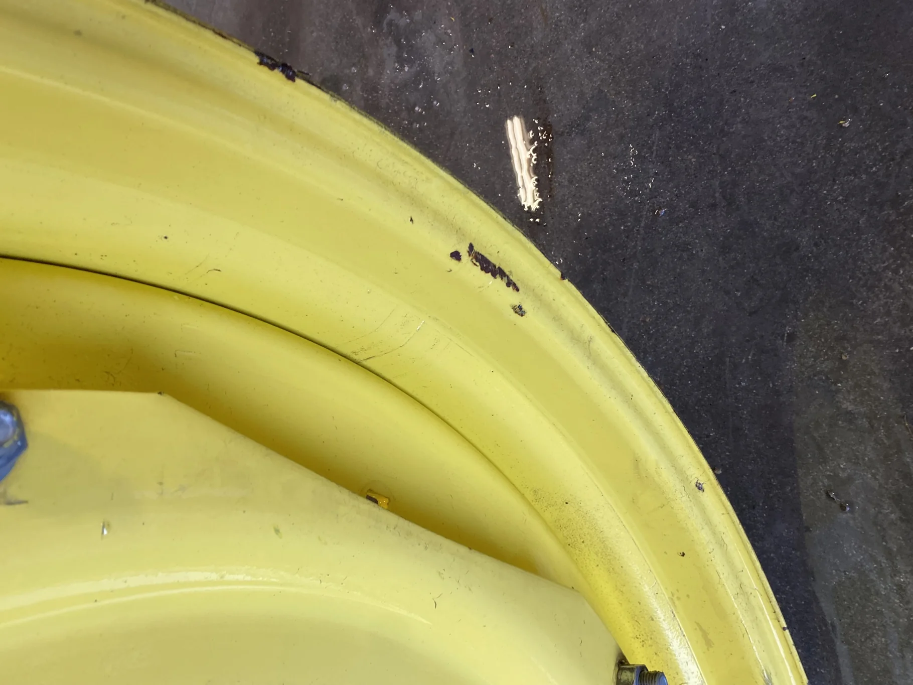 Used 10 X 42 John Deere Yellow Waffle Wheel (3 Bolt) (Faded Paint with Scratches) - Fair Condition image 5